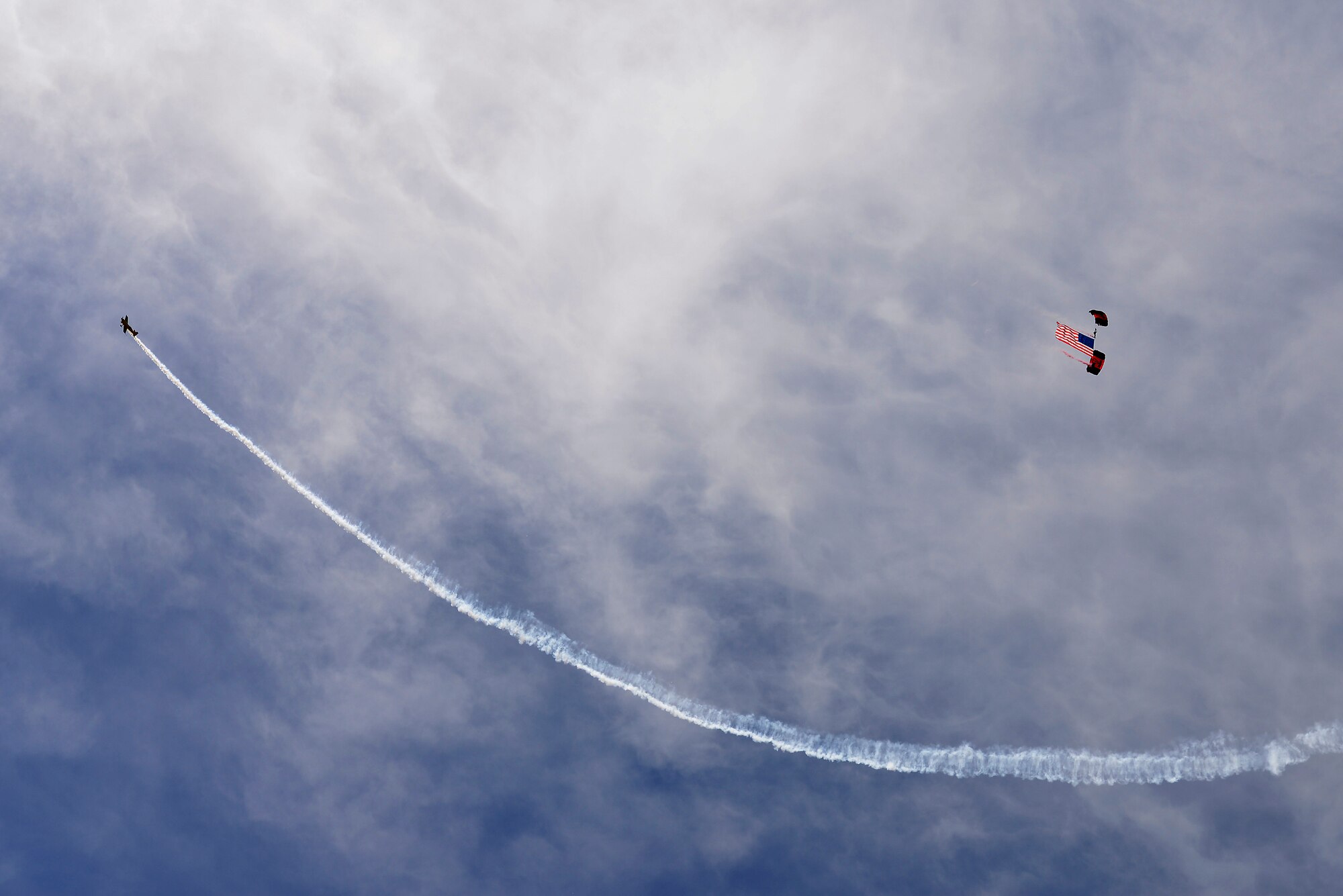 Members of the Black Daggers, the official U.S. Army Special Operations Command Parachute Demonstration Team, perform aerial stunts during Scott Air Force Base 2017 Air Show and Open House June 10, which celebrates the base’s 100th anniversary.  The black daggers use the military variant of the ram-air parachute, which is a flexible-wing glider. This allows a free-fall parachutist the ability to jump with more than 100 pounds of additional equipment. (U.S. Air Force photo by Tech. Sgt. Jonathan Fowler)