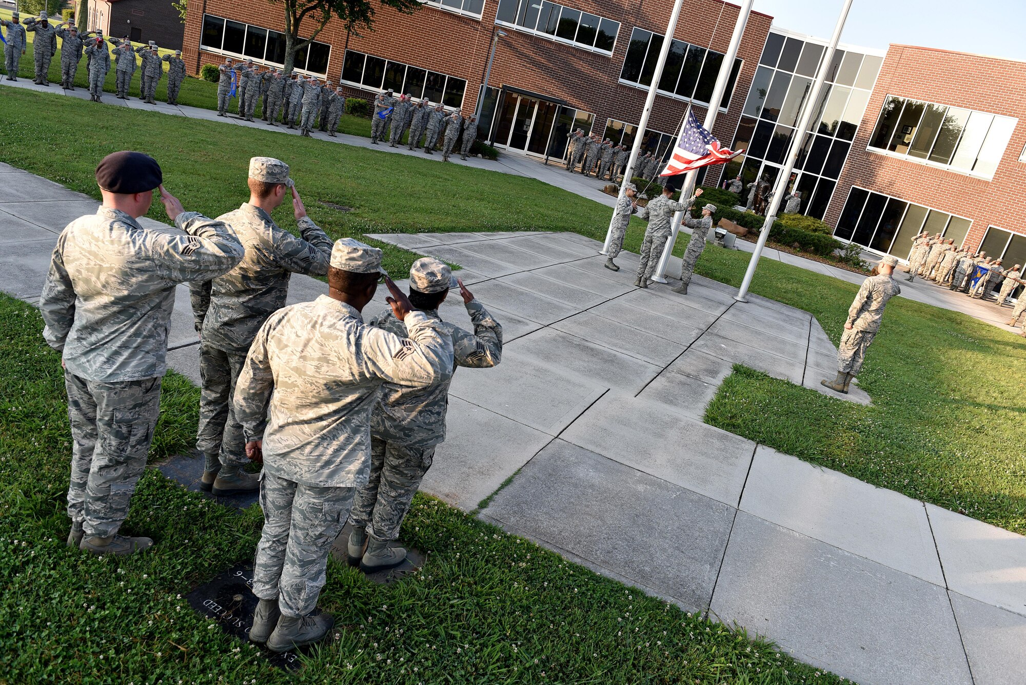 Senior Airmen in Airman Leadership School, classes 17-6 and 17-7 raise the flag, June 13, 2017, during morning reveille at the I.G. Brown Training and Education Center in Louisville, Tenn. About 42 Airmen in 17-6 will graduate their phase-two portion of the blended-learning course during a banquet this Friday. There are 163 Airmen in Class 17-7, undergoing the five-week in-resident course, which holds their graduation banquet June 29. (U.S. Air National Guard photo by Master Sgt. Mike R. Smith)