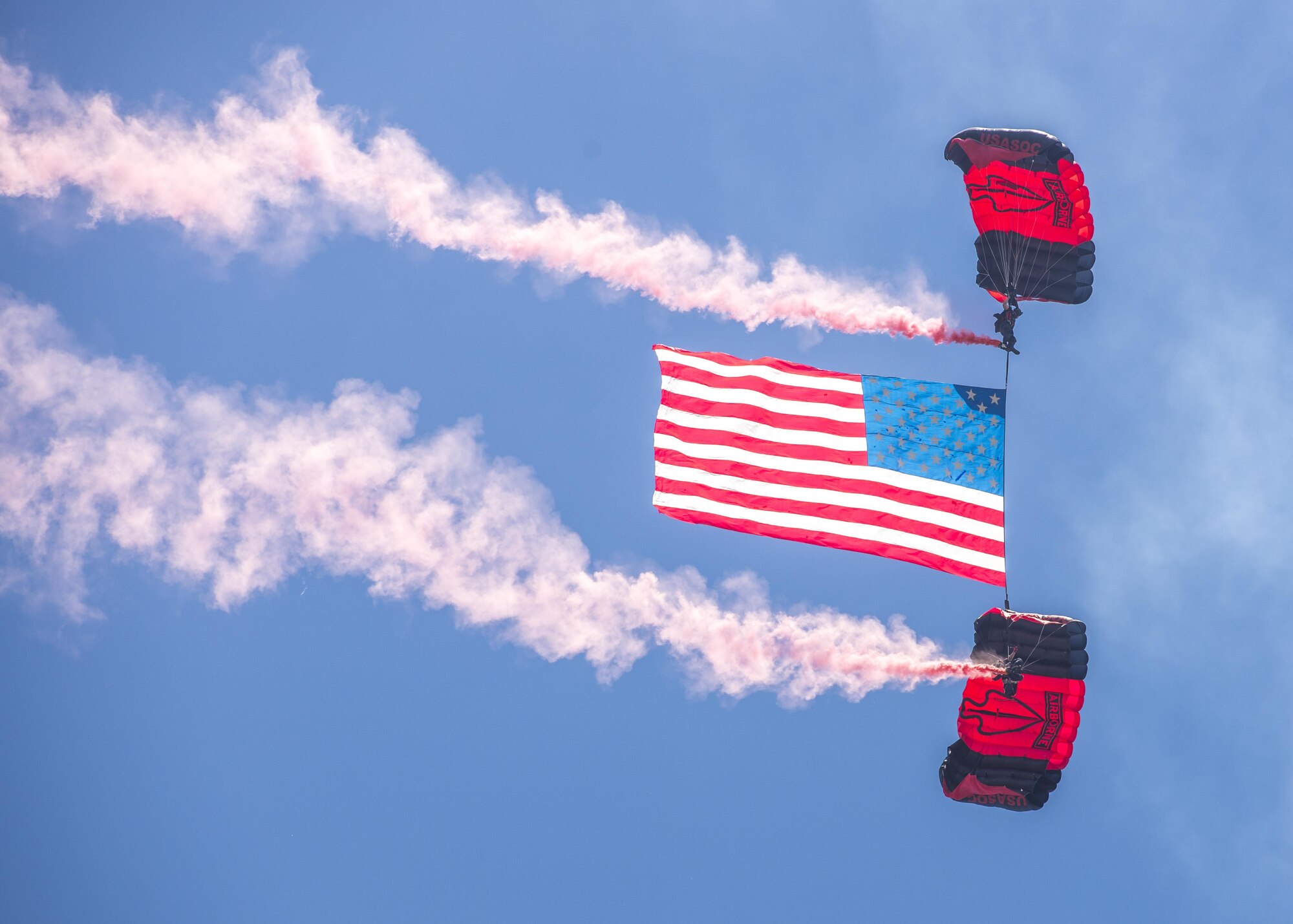 Members of the Black Daggers, the official U.S. Army Special Operations Command Parachute Demonstration Team, perform aerial stunts during Scott Air Force Base 2017 Air Show and Open House June 10, which celebrates the base’s 100th anniversary.  The black daggers use the military variant of the ram-air parachute, which is a flexible-wing glider.  This allows a free-fall parachutist the ability to jump with more than 100 pounds of additional equipment. (U.S. Air Force photo by Airman 1st Class Daniel Garcia)