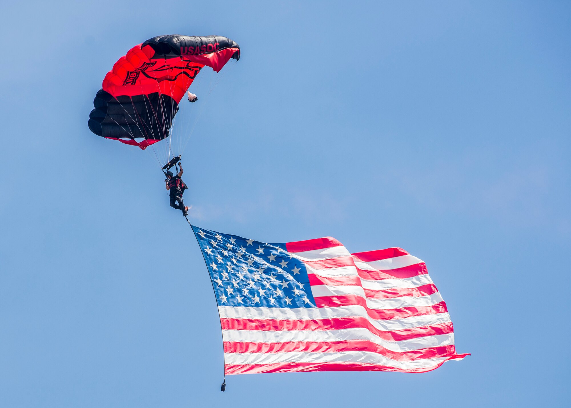 Members of the Black Daggers, the official U.S. Army Special Operations Command Parachute Demonstration Team, perform aerial stunts during Scott Air Force Base 2017 Air Show and Open House June 10, which celebrates the base’s 100th anniversary.  Black Daggers are highly trained Soldiers who insert themselves behind enemy lines to disrupt the movement of enemy troops and supplies to the front lines.  They frequently use parachutes to infiltrate without being detected. (U.S. Air Force photo by Airman 1st Class Daniel Garcia)