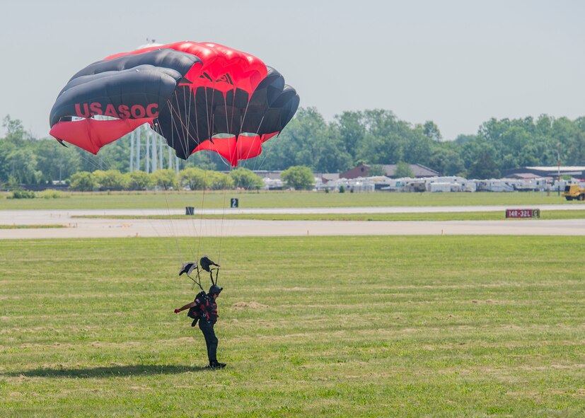 Members of the Black Daggers, the official U.S. Army Special Operations Command Parachute Demonstration Team, perform aerial stunts during Scott Air Force Base 2017 Air Show and Open House June 10, which celebrates the base’s 100th anniversary.  The black daggers use the military variant of the ram-air parachute, which is a flexible-wing glider.  This allows a free-fall parachutist the ability to jump with more than 100 pounds of additional equipment. (U.S. Air Force photo by Airman 1st Class Daniel Garcia)