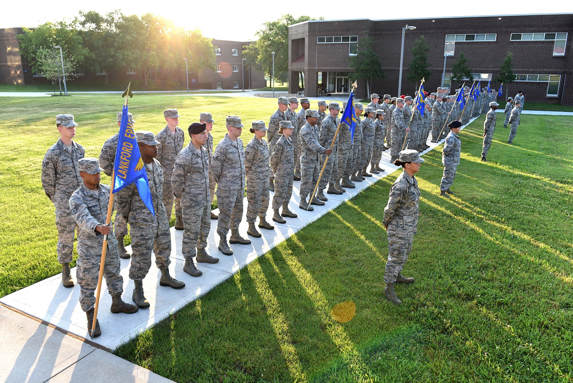 Senior Airmen in Airman Leadership School, classes 17-6 and 17-7 stand at parade rest, June 13, 2017, during morning reveille at the I.G. Brown Training and Education Center in Louisville, Tenn. About 42 Airmen in 17-6 will graduate their phase-two portion of the blended-learning course during a banquet this Friday. There are 163 Airmen in Class 17-7, undergoing the five-week in-resident course, which holds their graduation banquet June 29. (U.S. Air National Guard photo by Master Sgt. Mike R. Smith)