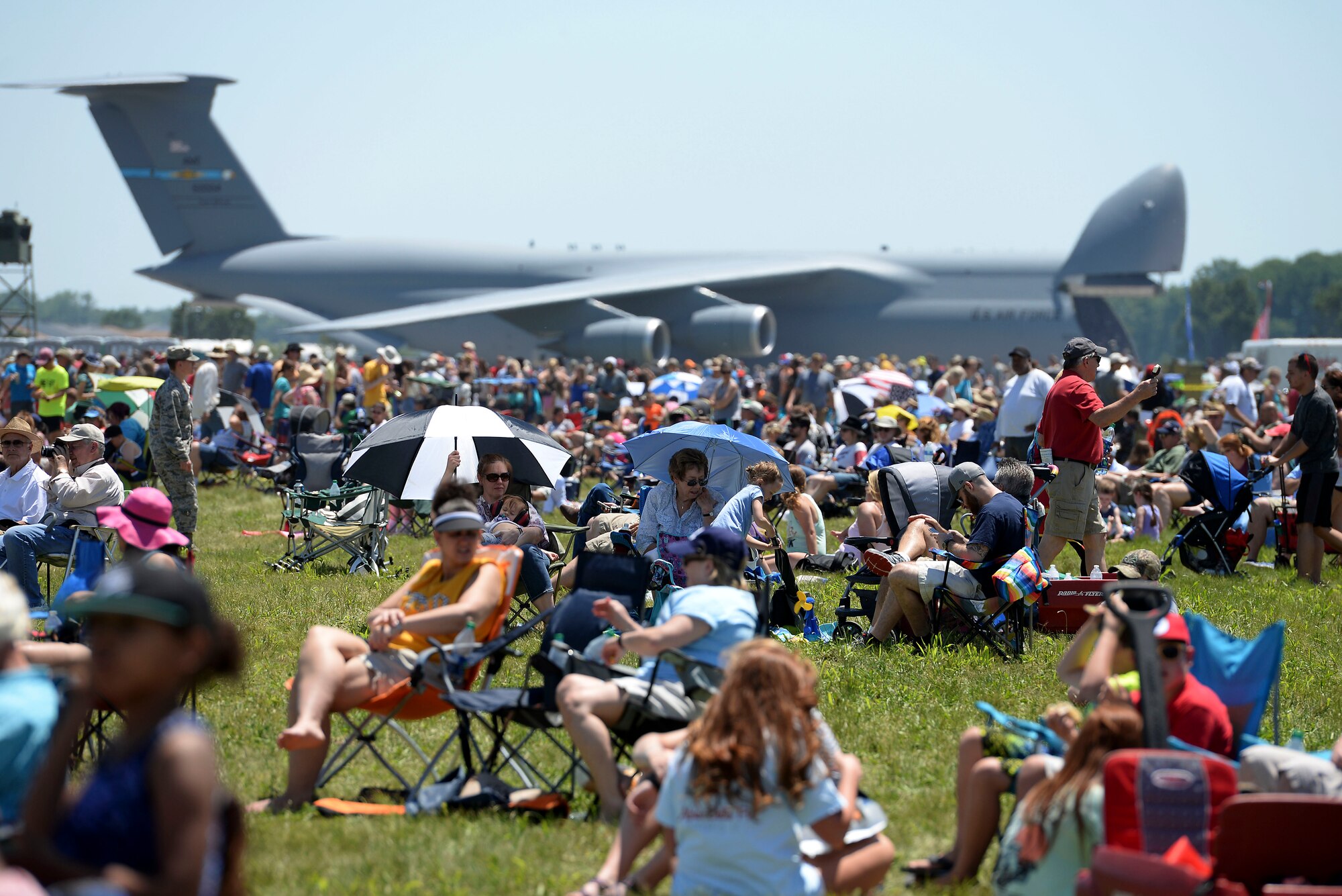 Crowds enjoy various performances and static displays during the Scott Airshow and Open House at Scott Air Force Base, Ill., June 10, 2017. The base hosted the air show and open house to celebrate the 100th year of Scott AFB.  Over 50 aircraft, ranging from WWI’s Curtiss JN-4 Jenny to the currently utilized KC-135 Stratotanker, came to Scott, the fourth oldest Air Force base. Demonstrations included the Black Daggers, “Tora, Tora, Tora,” and the USAF Thunderbirds. Opened in 1917 and previously named Scott Field, the base has seen its mission evolve and expand to encompass a multitude of priorities, including aeromedical evacuation and communications.  Today, Scott is home to 31 mission partners and provides around-the-clock logistics support and rapid global mobility, carried out primarily by U.S. Transportation Command and Air Mobility Command. (U.S. Air Force photo by Tech. Sgt. Jonathan Fowler)
