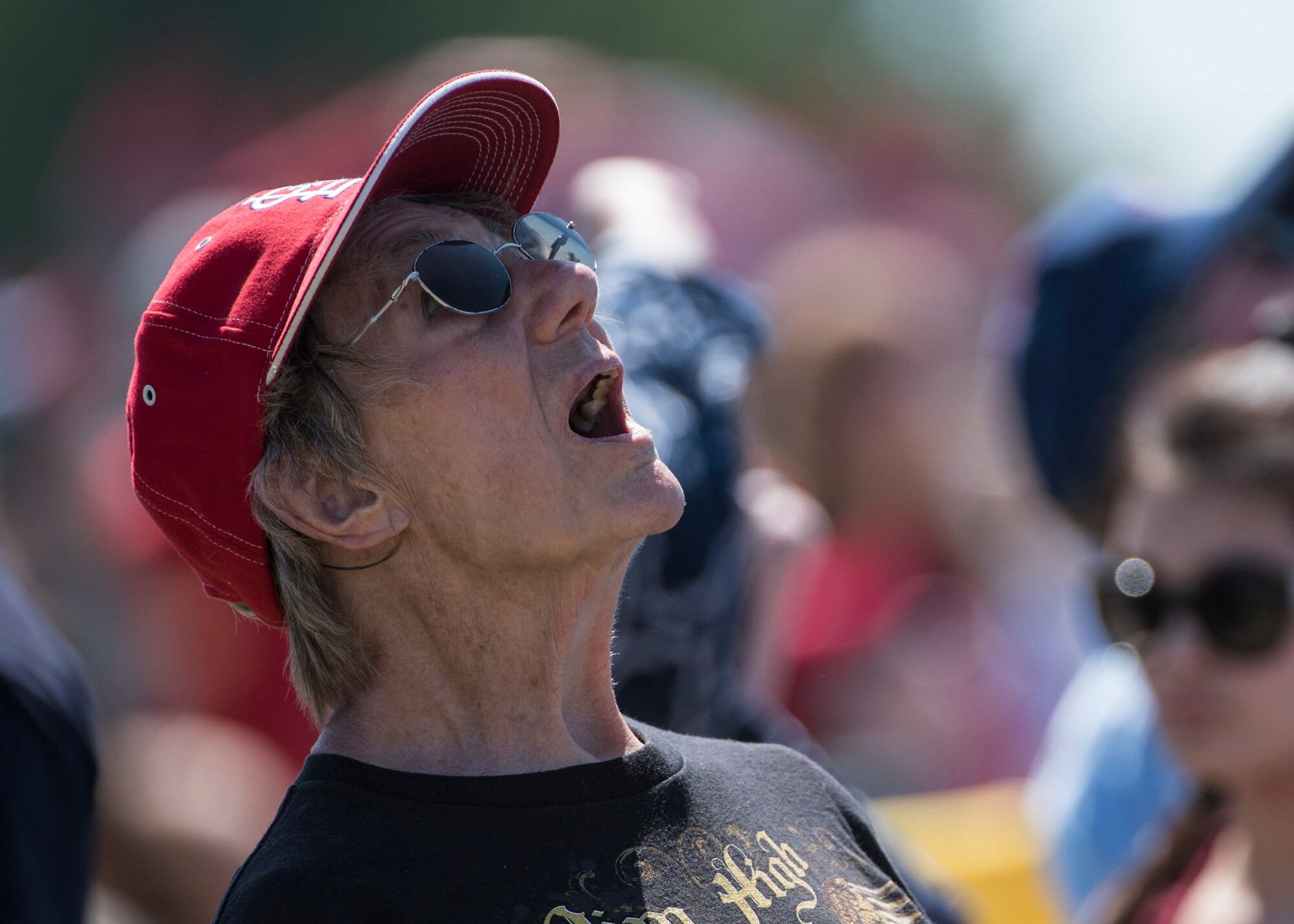 A spectator watches the Thunderbirds, officially known as the U.S. Air Force Air Demonstration Squadron, perform precision aerial maneuvers to demonstrate the capabilities the F-16 Fighter Falcon, the Air Force’s premier multi-role fighter jet, Scott Air Force Base, Ill., June 10, 2017.   The Thunderbirds performed their hour-long demonstration at speeds up to 600 mph and fly just a few feet of one another between wingtip to wingtip. This highly maneuverable fighter has proven to be one of the world's best precision tactical bomber and air-to-air combat aircraft.