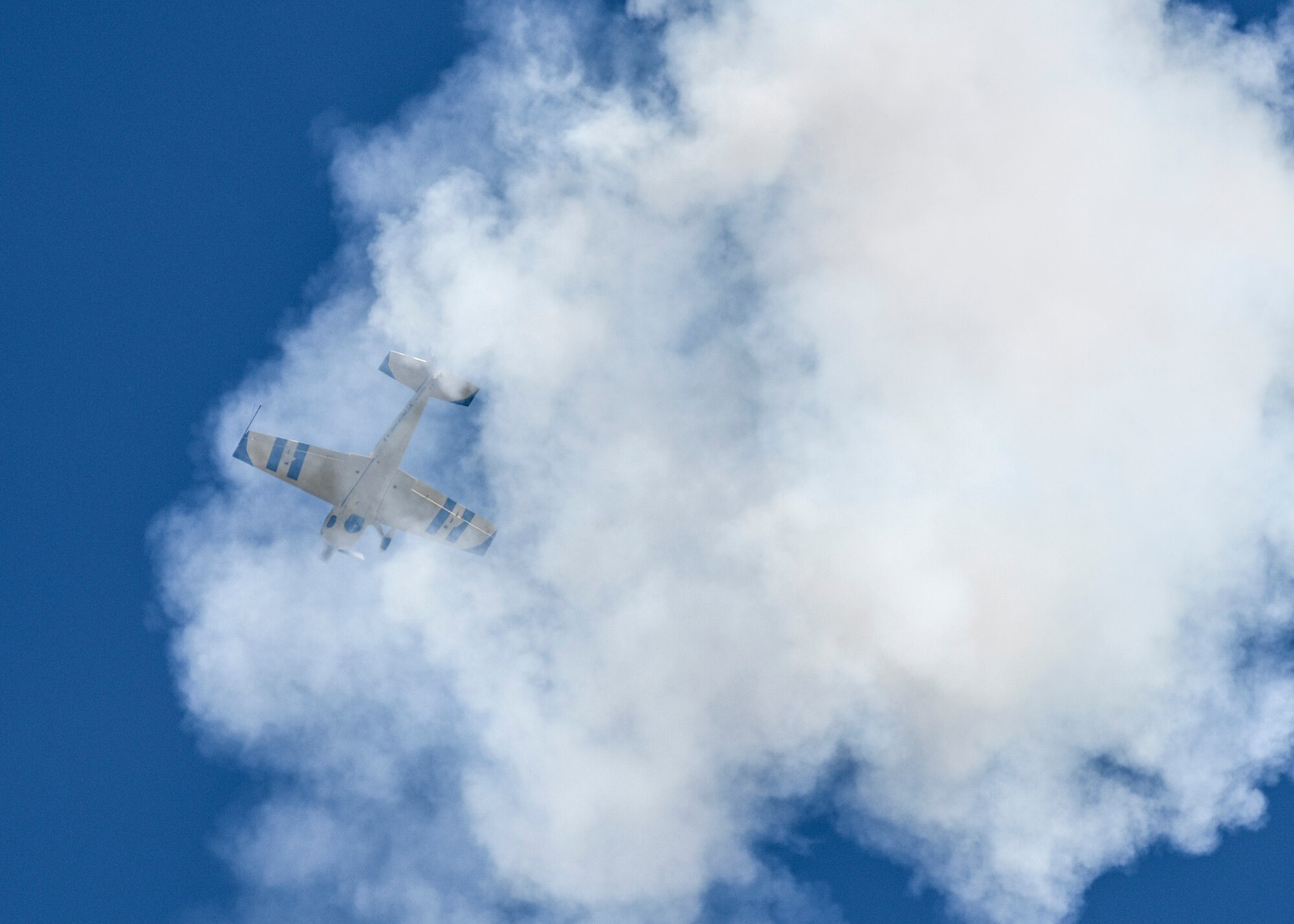 Kevin Coleman performs during the 100th Centennial Celebration Air Show, June 11, 2017, at Scott Air Force Base, Ill. Kevin has accumulated more than 2500 hours of flying time. He has been recognized as the highest placing contender at the 2007 Aerobatic Championship, and the next year clinched third place at the same event. He is contracted to perform year-round in the air show circuit across the country, and in 2015, a lifetime of practice paid off when he earned a position on the U.S. Advanced Aerobatic Team – the Olympics of aviation.