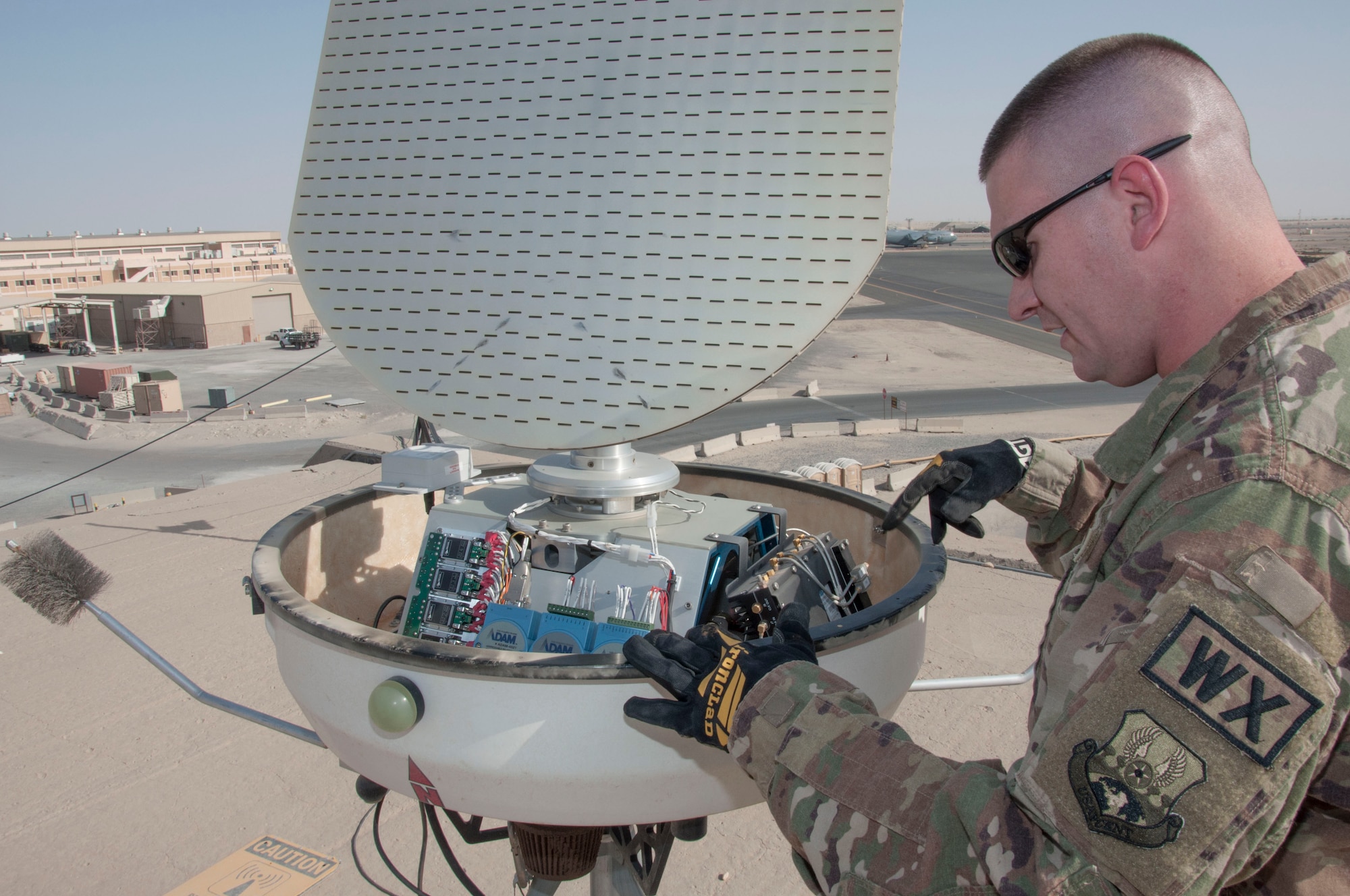 Tech. Sgt. Keith Wilson inspects the internal components of a portable Doppler radar unit during a preventative maintenance inspection at an undisclosed location in southwest Asia, June 11, 2017. Proper function of the Doppler allows for accurate weather forecasting.