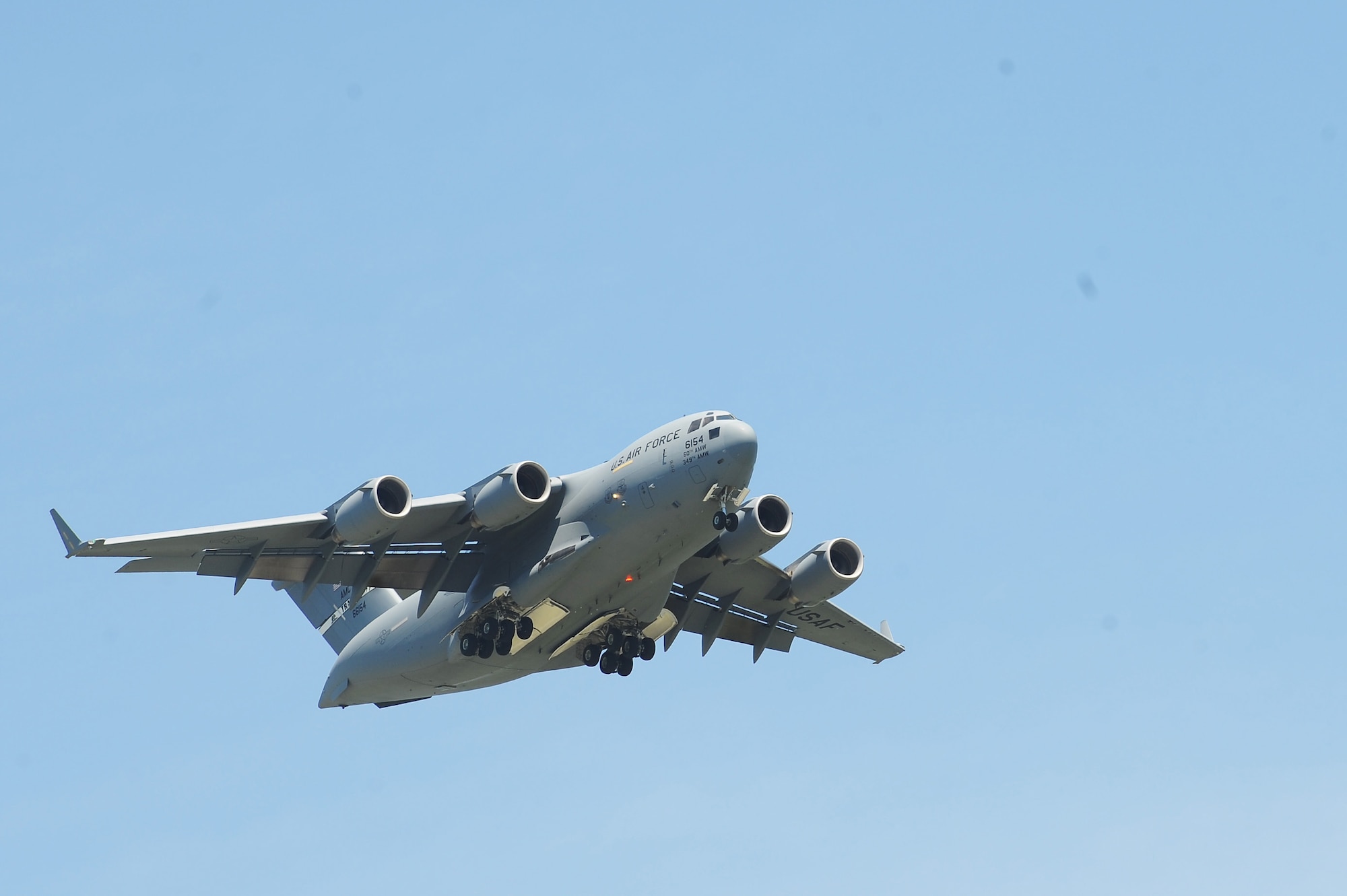 A 15th Wing C-17 Globemaster III conducts a fly-by during the Scott Air Force Base 2017 Air Show and Open House June 10, which celebrates the base’s 100th anniversary.  The C-17 is capable of rapid strategic delivery of troops and all types of cargo to main operating bases or directly to deployed locations.  The aircraft can perform tactical airlift and airdrop missions and can also transport litters and ambulatory patients during aeromedical evacuations.  The C-17 is designed to airdrop 102 paratroopers and equipment. (U.S. Air Force photo by Tech. Sgt. Maria Castle)