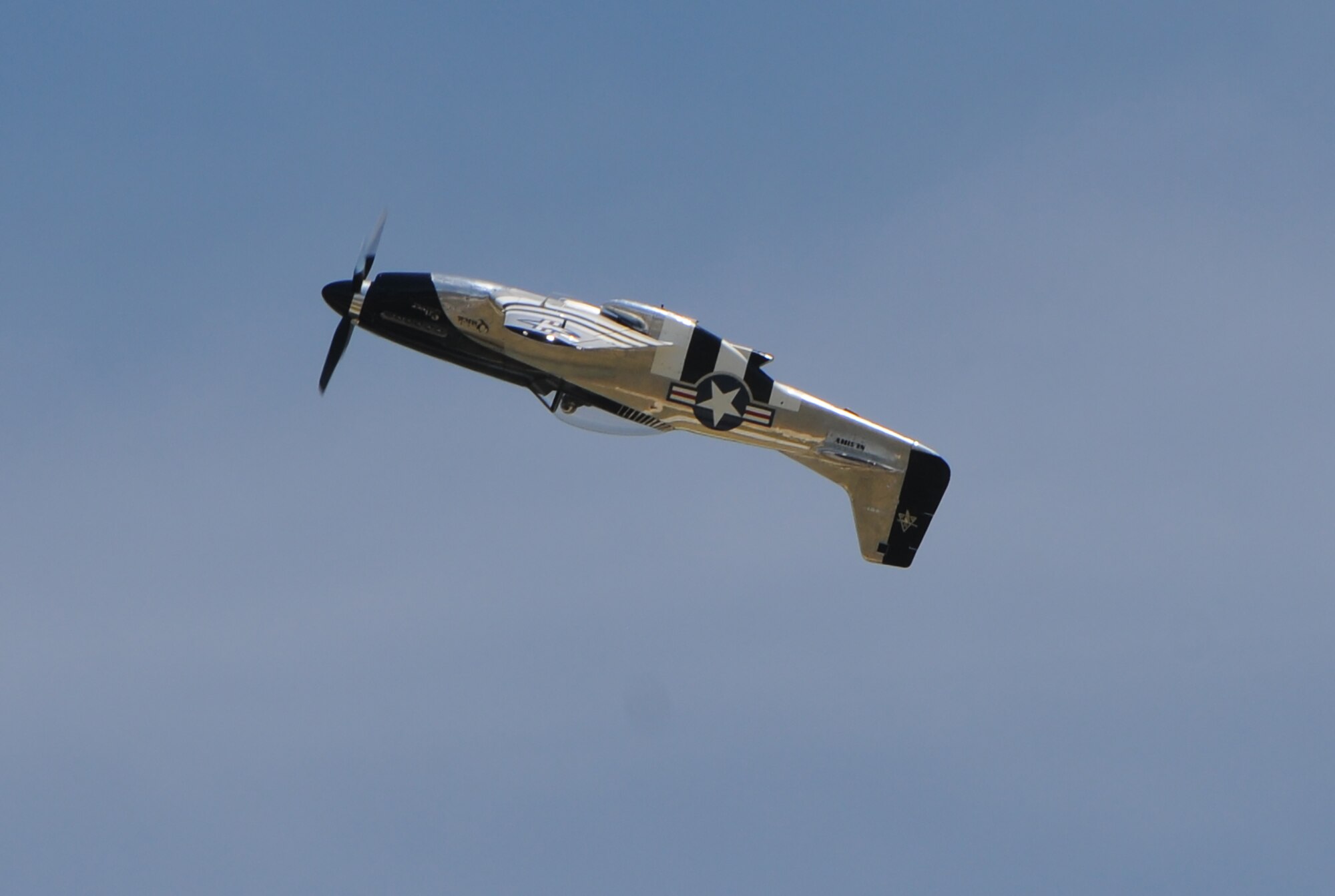 Scott Yoak performs air combat maneuvers in the P-51 Mustang during the 100th Centennial Celebration Air Show, June 10, 2017, at Scott Air Force Base, Ill. A veteran of World War II and the Korean War, North American Aviation’s P-51 Mustang was the first U.S. built fighter airplane to push its nose over Europe after the fall of France. Mustangs met and conquered every German plane from the early Junkers to the sleek, twin-jet Messerschmitt 262s. (U.S. Air Force photo by Senior Airman Alexandria Rockford)
