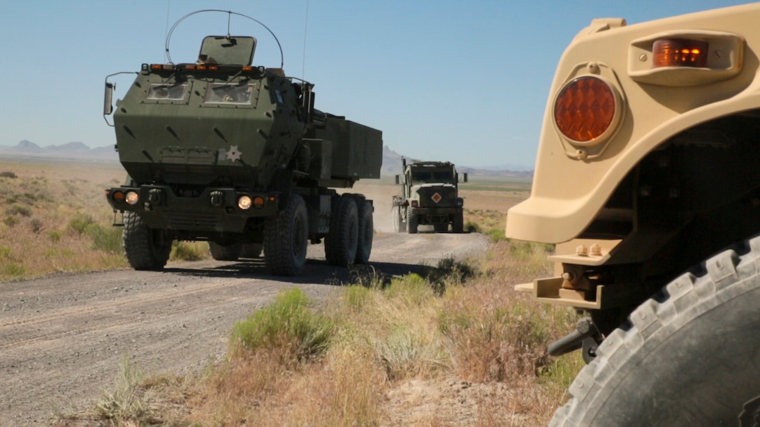 Marines with Battery D, 2nd Battalion, 14th Marines Regiment, 4th Marine Division, Marine Forces Reserve drive in a convoy toward their field fire position during their unit annual training at Dugway Proving Grounds, Utah, June 12, 2017. Throughout the days, the Marines participated in multiple operations and evaluated qualification exercises to include; machine guns, grenades and rifle ranges, live fire and night convoy operations, battery movement in small arms ranges and artillery operations. (U.S. Marines Corps photo by Sgt. Ian Ferro)