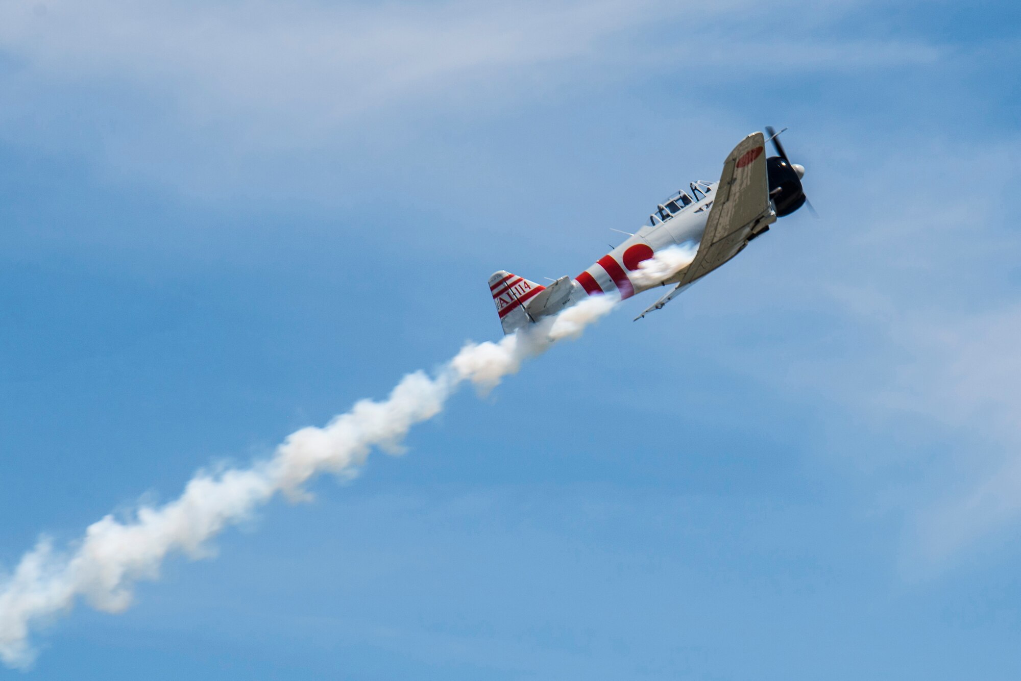 "Tora, Tora, Tora," performs the re-creation of the Dec. 7, 1941, attack on Pearl Harbor during the 100th Centennial Celebration Air Show, June 10, 2017, at Scott Air Force Base, Ill. The motto of the Commemorative Air Force and the "Tora" act is "Lest We Forget." Tora is not intended to promote nationalism or glorify war. The intent of the Tora group is to help generations of individuals throughout the world born after World War II understand that war does not discriminate in the pain it causes and that courageous individuals on both sides lose their lives. (U.S. Air Force photo/Senior Airman Tristin English)