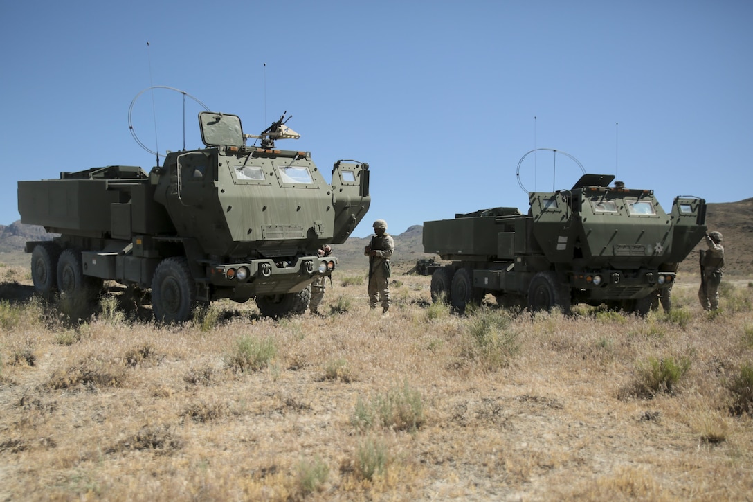Marines with Battery D, 2nd Battalion, 14th Marines Regiment, 4th Marine Division, Marine Forces Reserve prepare to conduct exercises with High Mobility Artillery Rocket Systems during their unit annual training at Dugway Proving Grounds, Utah, June 12, 2017. Throughout the days, the Marines participated in multiple operations and evaluated qualification exercises to include; machine guns, grenades and rifle ranges, live fire and night convoy operations, battery movement in small arms ranges and artillery operations. (U.S. Marines Corps photo by Sgt. Ian Ferro)