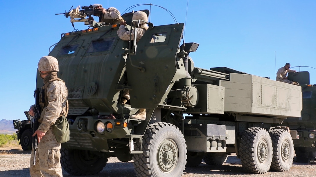 Marines with Battery D, 2nd Battalion, 14th Marines Regiment, 4th Marine Division, Marine Forces Reserve prepare to conduct exercises with High Mobility Artillery Rocket Systems during their unit annual training at Dugway Proving Grounds, Utah, June 12, 2017. Throughout the days, the Marines participated in multiple operations and evaluated qualification exercises to include; machine guns, grenades and rifle ranges, live fire and night convoy operations, battery movement in small arms ranges and artillery operations. (U.S. Marines Corps photo by Sgt. Ian Ferro)