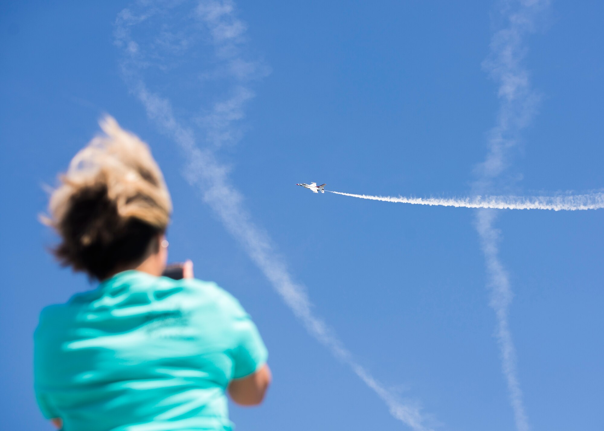 The Thunderbirds, officially known as the U.S. Air Force Air Demonstration Squadron, performs precision aerial maneuvers to demonstrate the capabilities the F-16 Fighter Falcon, the Air Force’s premier multi-role fighter jet, Scott Air Force Base, Ill., June 11, 2017.   Eight highly experienced fighter pilots, four support officers, three civilians, and over 120 enlisted personnel help make it possible for the team to showcase the capabilities of this fighter jet to millions of people each year.  Together, this team has ensured that a demonstration has never been cancelled due to maintenance difficulty. (U.S.Air Force photo by Airman 1st Class Daniel Garcia)