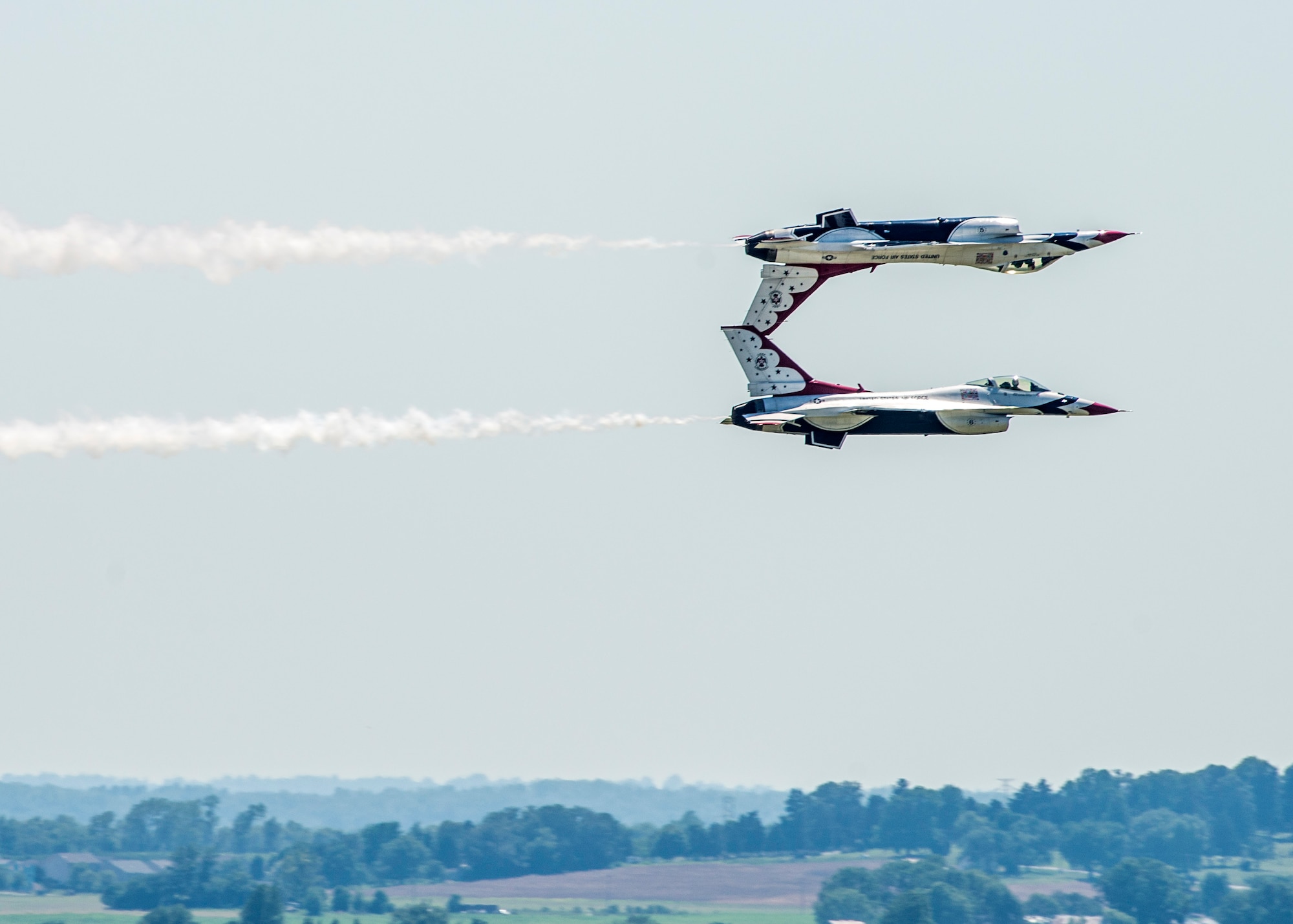 The Thunderbirds, officially known as the U.S. Air Force Air Demonstration Squadron, performs precision aerial maneuvers to demonstrate the capabilities the F-16 Fighter Falcon, the Air Force’s premier multi-role fighter jet, Scott Air Force Base, Ill., June 11, 2017.   Eight highly experienced fighter pilots, four support officers, three civilians, and over 120 enlisted personnel help make it possible for the team to showcase the capabilities of this fighter jet to millions of people each year.  Together, this team has ensured that a demonstration has never been cancelled due to maintenance difficulty. (U.S.Air Force photo by Airman 1st Class Daniel Garcia)