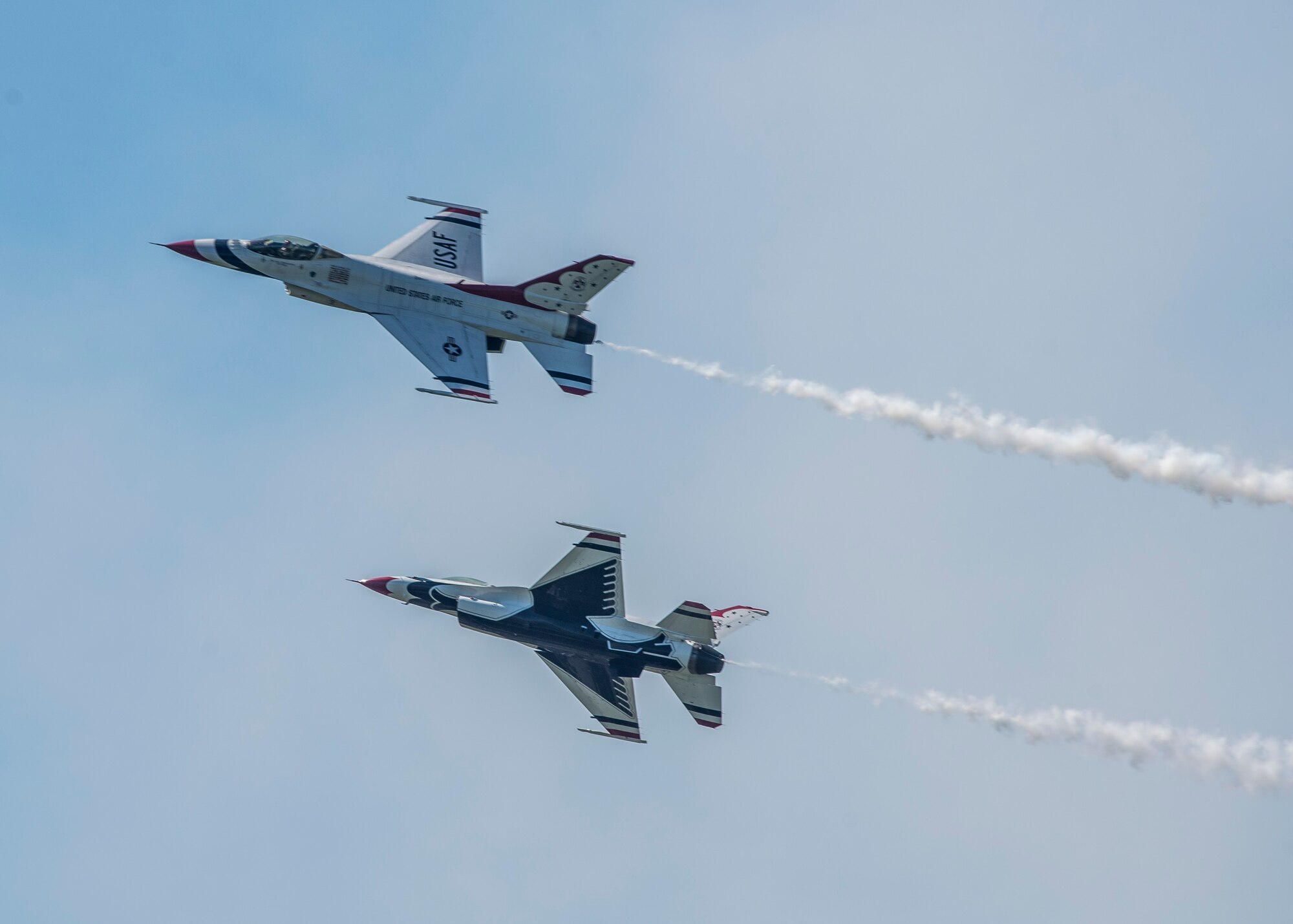 The Thunderbirds, officially known as the U.S. Air Force Air Demonstration Squadron, performs precision aerial maneuvers to demonstrate the capabilities the F-16 Fighter Falcon, the Air Force’s premier multi-role fighter jet, Scott Air Force Base, Ill., June 11, 2017.   Eight highly experienced fighter pilots, four support officers, three civilians, and over 120 enlisted personnel help make it possible for the team to showcase the capabilities of this fighter jet to millions of people each year.  Together, this team has ensured that a demonstration has never been cancelled due to maintenance difficulty. (U.S.Air Force photo by Airman 1st Class Daniel Garcia)
