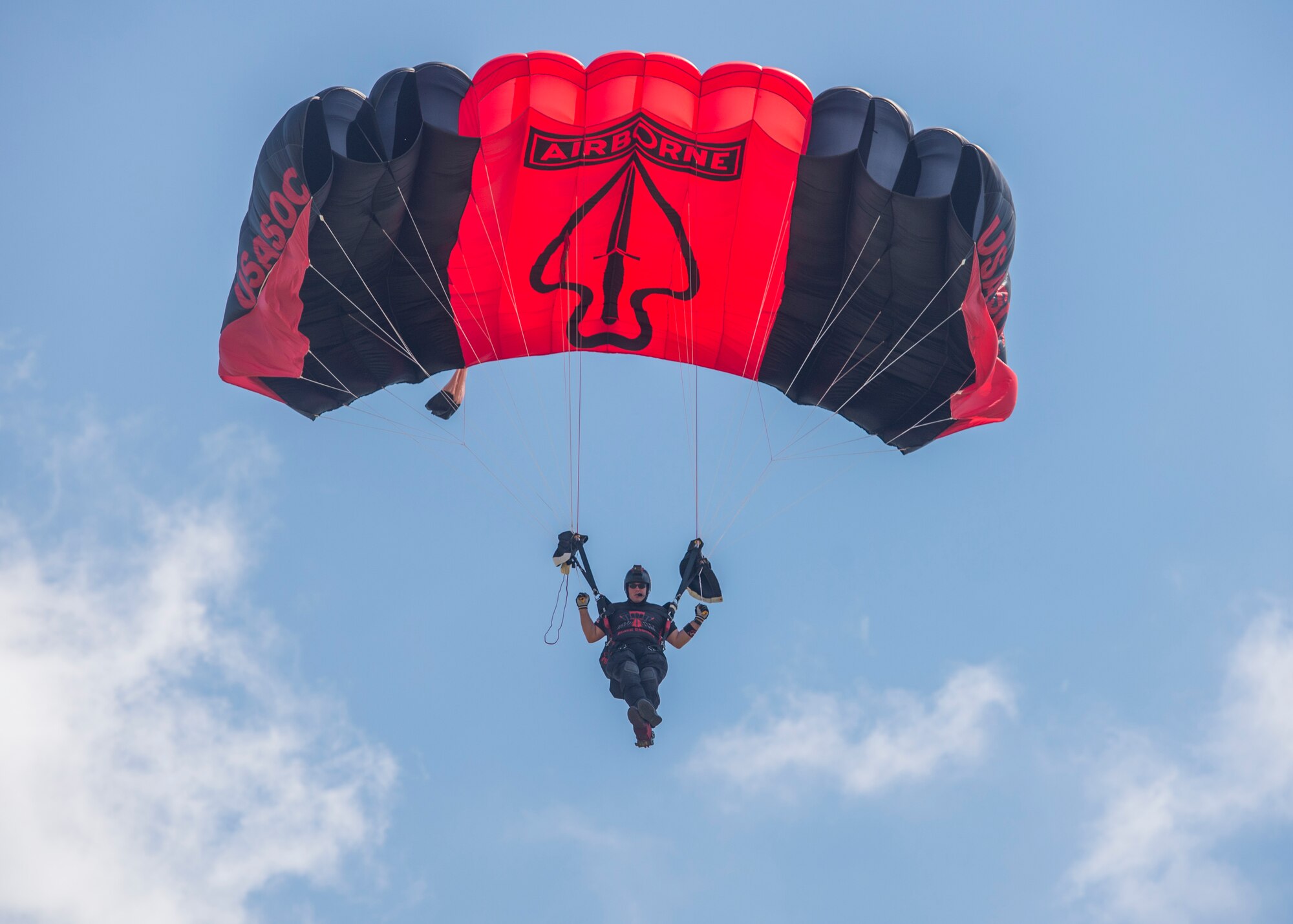 Members of the Black Daggers, the official U.S. Army Special Operations Command Parachute Demonstration Team, perform aerial stunts during Scott Air Force Base 2017 Air Show and Open House June 11, which celebrates the base’s 100th anniversary.  Black Daggers are highly trained Soldiers who insert themselves behind enemy lines to disrupt the movement of enemy troops and supplies to the front lines.  They frequently use parachutes to infiltrate without being detected. (Air Force photo by Airman 1st Class Daniel Garcia)