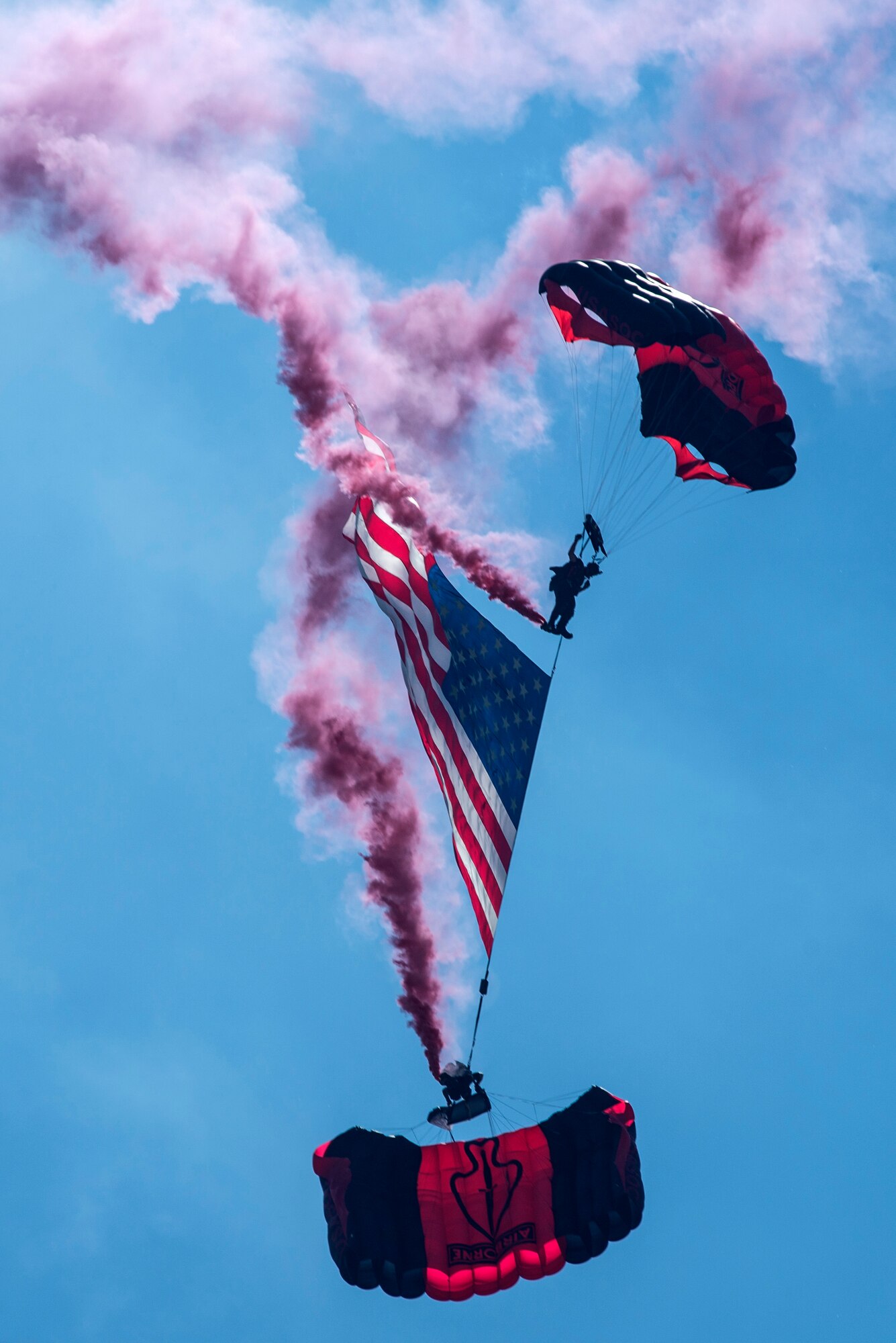 Members of the Black Daggers, the official U.S. Army Special Operations Command Parachute Demonstration Team, perform aerial stunts during Scott Air Force Base 2017 Air Show and Open House June 9, which celebrates the base’s 100th anniversary.  The black daggers use the military variant of the ram-air parachute, which is a flexible-wing glider.  This allows a free-fall parachutist the ability to jump with more than 100 pounds of additional equipment.(U.S. Air Force photo/Senior Airman Tristin English)