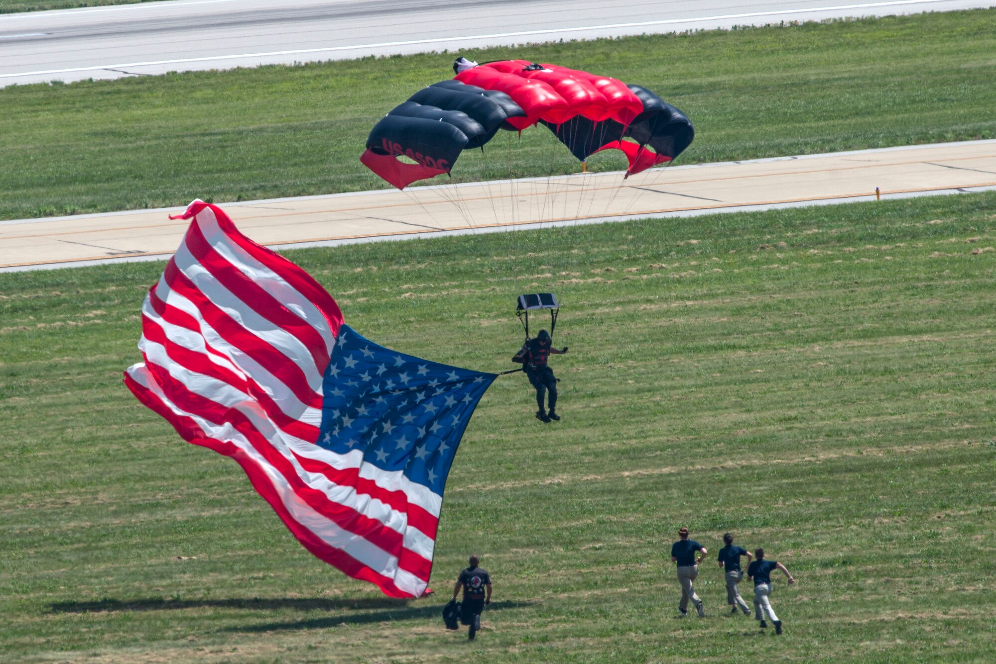 Members of the Black Daggers, the official U.S. Army Special Operations Command Parachute Demonstration Team, perform aerial stunts during Scott Air Force Base 2017 Air Show and Open House June 11, which celebrates the base’s 100th anniversary.  The black daggers use the military variant of the ram-air parachute, which is a flexible-wing glider.  This allows a free-fall parachutist the ability to jump with more than 100 pounds of additional equipment.(U.S. Air Force photo/Senior Airman Tristin English)