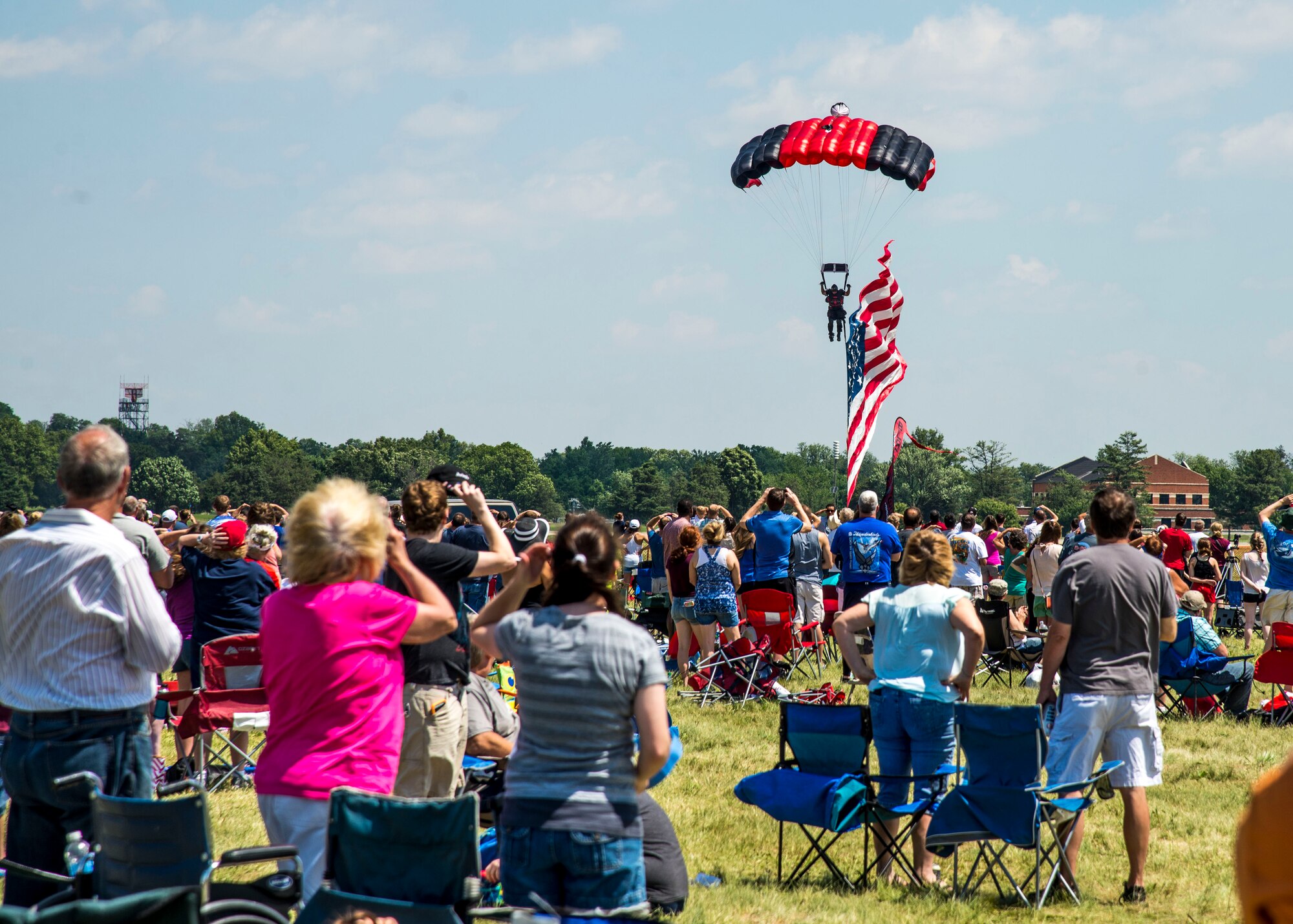 Members of the Black Daggers, the official U.S. Army Special Operations Command Parachute Demonstration Team, perform aerial stunts during Scott Air Force Base 2017 Air Show and Open House June 11, which celebrates the base’s 100th anniversary.  Black Daggers are highly trained Soldiers who insert themselves behind enemy lines to disrupt the movement of enemy troops and supplies to the front lines.  They frequently use parachutes to infiltrate without being detected. (Air Force photo by Airman 1st Class Daniel Garcia)