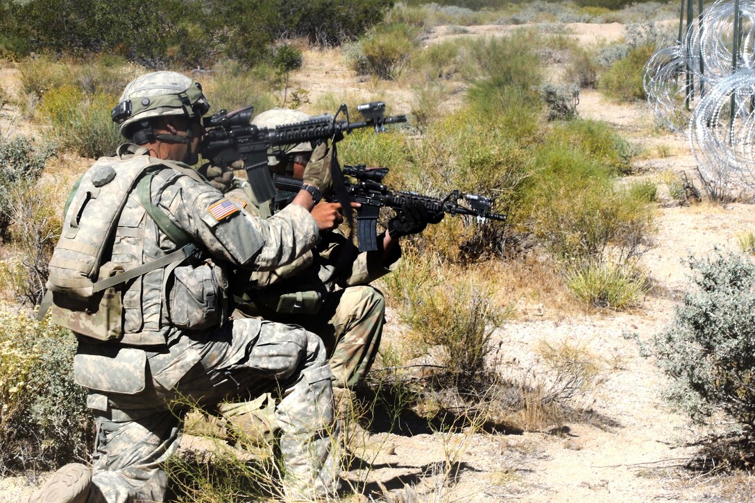 Mississippi Army National Guardsmen provide security for team members as they breach obstacles during a live-fire exercise at the National Training Center, Fort Irwin, Calif., June 9, 2017. Mississippi National Guard photo by Spc. Justin Humphreys