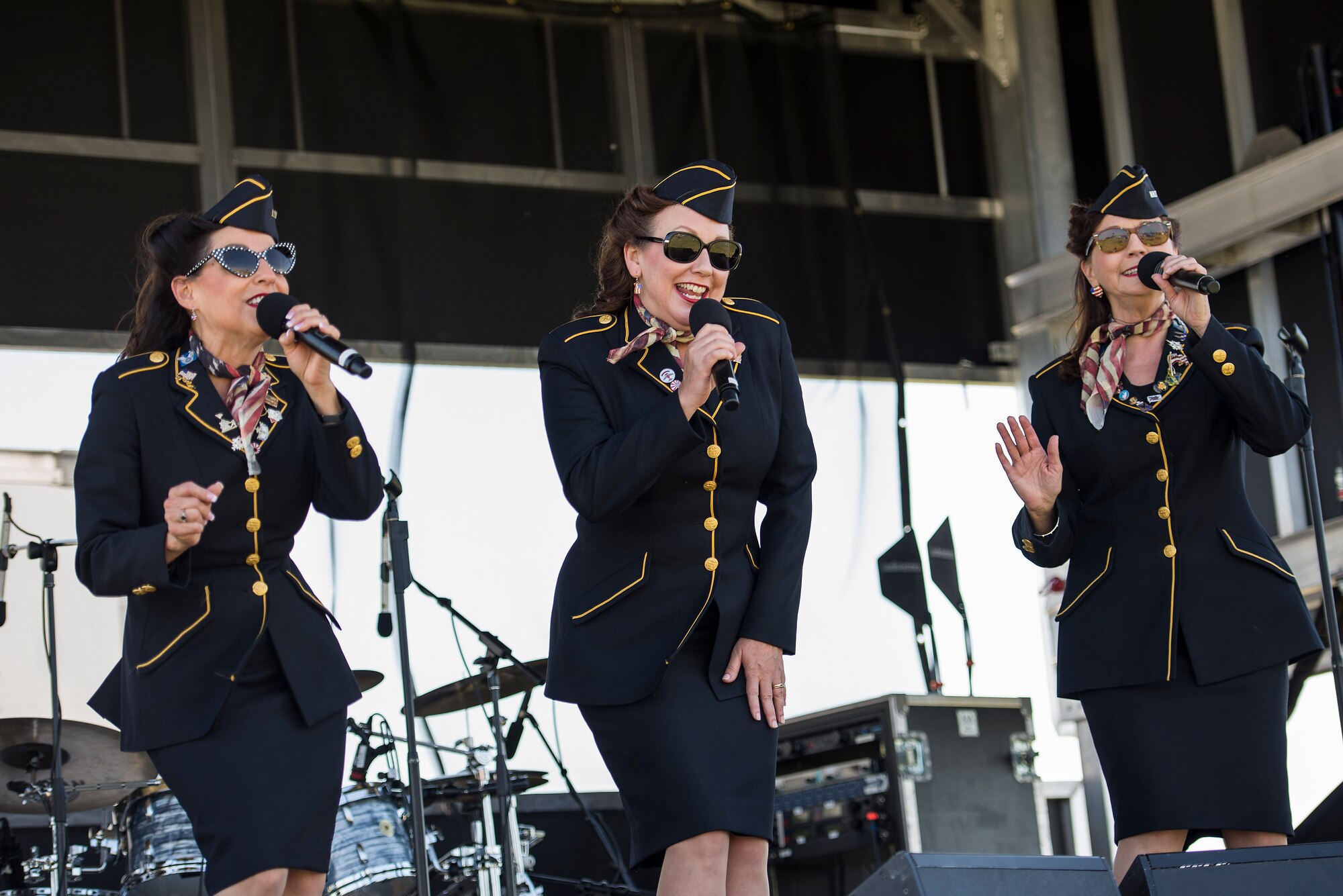 The Ladies for Liberty perform during the Scott Airshow and Open House at Scott Air Force Base, Ill., June 11, 2017. Ladies for Liberty is a singing troupe dedicated to performing the Andrew Sisters style of music through their own rendition of vocals, costumes, hairstyles, and the spirit of patriotism reminiscent of the 1940s. (U.S. Air Force photo by Tech. Sgt. Jonathan Fowler)
