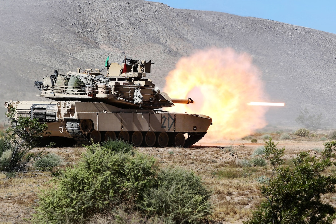 Mississippi Army National Guardsmen fire an M1A1 Abrams main battle tank gun, a 120 mm sabot round, during a battalion hasty defense live-fire exercise at the National Training Center at Fort Irwin, Calif., June 9, 2017. Mississippi National Guard photo by Staff Sgt. Shane Hamann