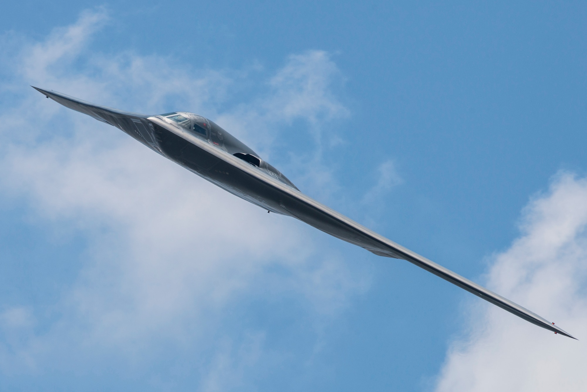 A 509th Bomb Wing B-2 Spirit conducts a fly-by during the Scott Air Force Base 2017 Air Show and Open House June 11, which celebrates the base’s 100th anniversary.  The B-2 is a multi-role bomber capable of delivering both conventional and nuclear munitions and represents a major milestone in the U.S. bomber modernization program.  With a crew of two pilots, this aircraft brings a massive firepower to bear, in a short time, anywhere on the globe through impenetrable defenses.