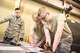 During a rodeo challenge conducted by the 167th Airlift Wing small air terminal in Martinsburg, W.Va., air transportation specialist, Staff Sgt. Chester McDonald (left), Staff Sgt. Levi Cameron (middle) and Staff Sgt. Aaron Wagner (right) work on a joint inspection (JI) that prepares cargo for air transportation, June 10, 2017. The competition involved inspecting a 10k all terrain forklift, maneuvering through a 10k standard forklift obstacle course, a joint inspection and a chain-gate cargo build-up. (U.S. Air National Guard photo by Staff Sgt. Jodie Witmer)