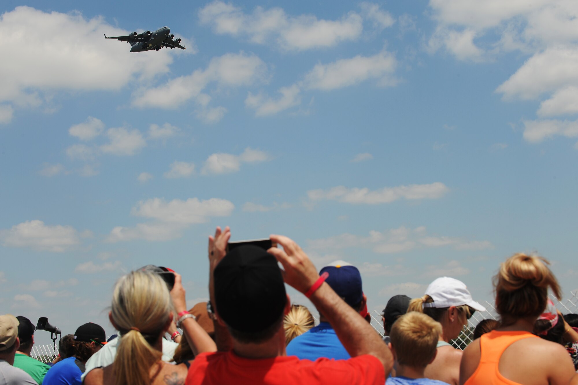 A 15th Wing C-17 Globemaster III conducts a fly-by during the Scott Air Force Base 2017 Air Show and Open House June 11, which celebrates the base’s 100th anniversary.  The aircraft is normally operated by a crew of three people: pilot, co-pilot and loadmaster. Cargo is loaded onto the C-17 through a large aft door that accommodates military vehicles and palletized cargo.  The aircraft can take off and land on runways as short as 3,500 feet long and only 90 feet wide. (U.S. Air Force photo by Tech. Sgt. Maria Castle)