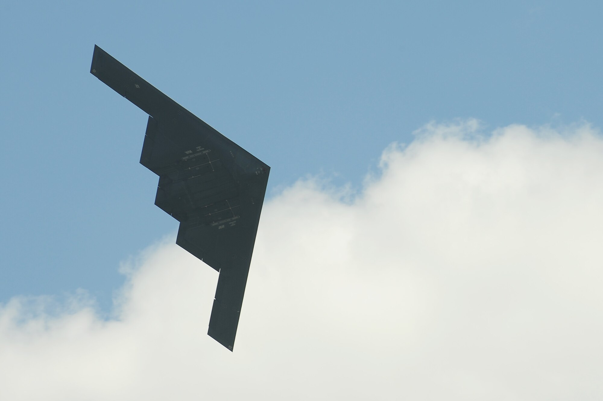 A 509th Bomb Wing B-2 Spirit conducts a fly-by during the Scott Air Force Base 2017 Air Show and Open House June 11, which celebrates the base’s 100th anniversary.  The B-2 is a multi-role bomber capable of delivering both conventional and nuclear munitions and represents a major milestone in the U.S. bomber modernization program.  With a crew of two pilots, this aircraft brings a massive firepower to bear, in a short time, anywhere on the globe through impenetrable defenses.  (U.S. Air Force photo by Tech. Sgt. Maria Castle)