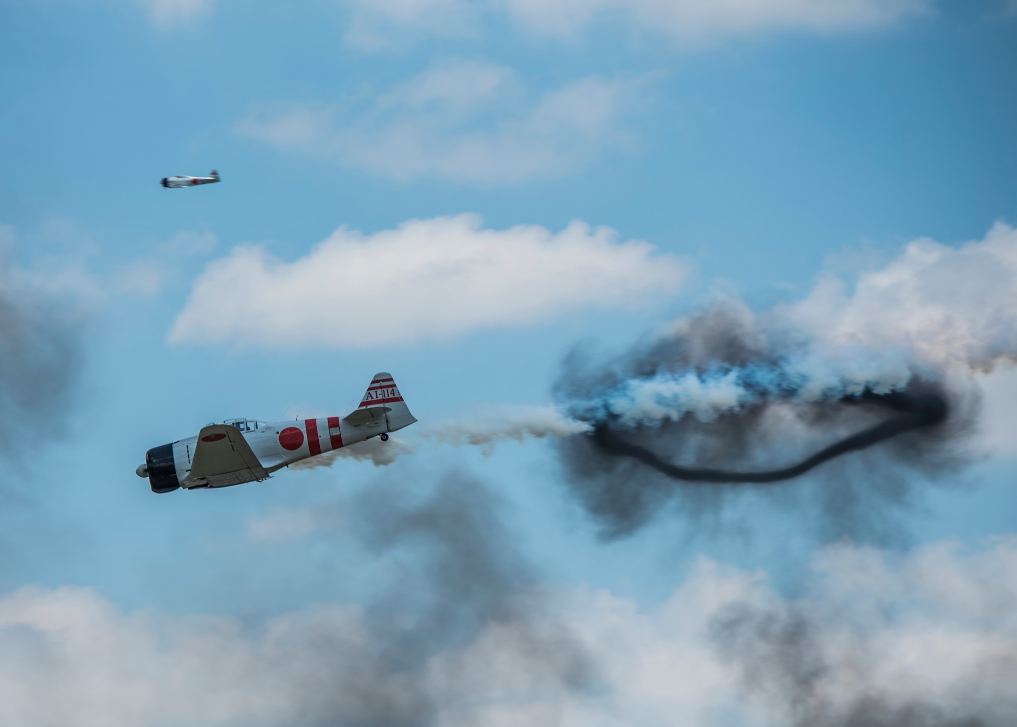 "Tora, Tora, Tora," performs the re-creation of the Dec. 7, 1941, attack on Pearl Harbor during the 100th Centennial Celebration Air Show, June 11, 2017, at Scott Air Force Base, Ill. Tora, Tora, Tora began in 1972, when six replica Japanese aircraft used in the movie of the same name were donated to the CAF. The act debuted at the Galveston Air Show on June 25, 1972 and by 1977, Tora had gained national exposure. In 1991 Tora participated extensively in the 50th anniversary year commemorations of Pearl Harbor.  (U.S. Air Force photo by Staff Sgt. Jodi Martinez)
