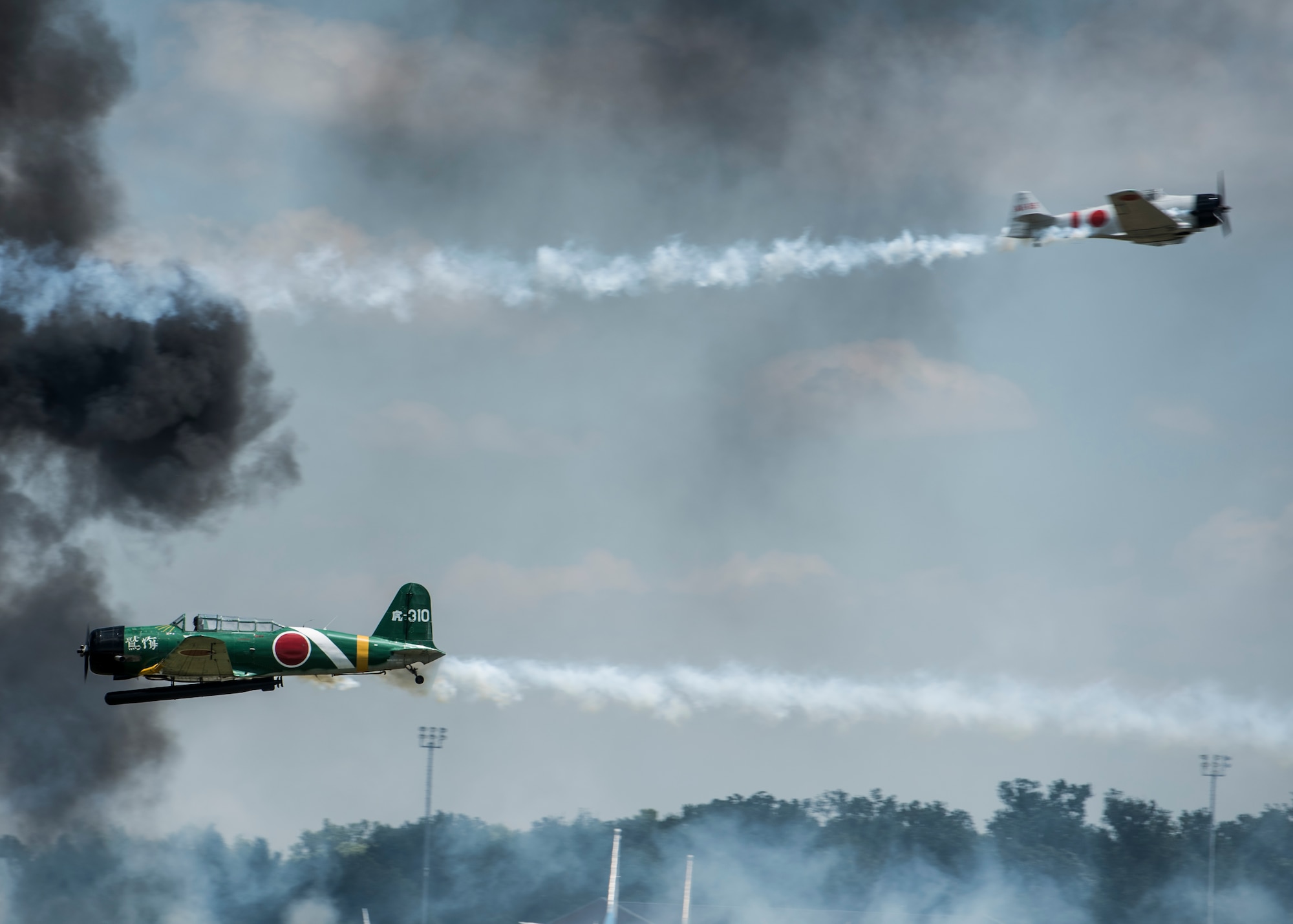 "Tora, Tora, Tora," performs the re-creation of the Dec. 7, 1941, attack on Pearl Harbor during the 100th Centennial Celebration Air Show, June 11, 2017, at Scott Air Force Base, Ill. Tora, Tora, Tora began in 1972, when six replica Japanese aircraft used in the movie of the same name were donated to the CAF. The act debuted at the Galveston Air Show on June 25, 1972 and by 1977, Tora had gained national exposure. In 1991 Tora participated extensively in the 50th anniversary year commemorations of Pearl Harbor.  (U.S. Air Force photo by Staff Sgt. Jodi Martinez)
