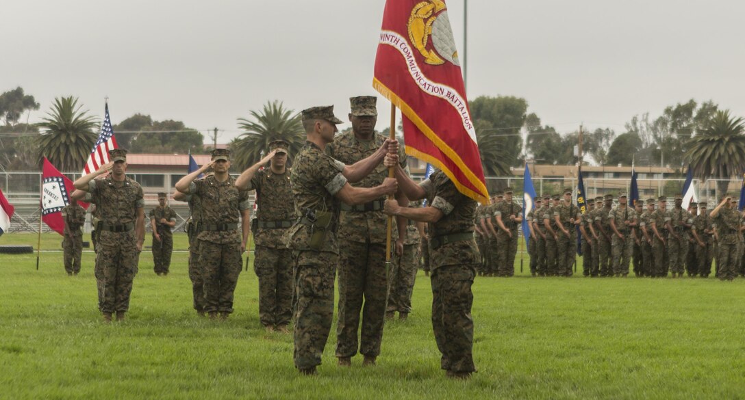 Lt. Col. Damon K. Burrows (right) passes the 9th Communication Battalion’s organizational colors to Lt. Col. Bryan A. Eovito during the change of command ceremony at Camp Pendleton, Calif. June 8, 2017. Eovito was the deputy plans and operations officer for 3rd Marine Aircraft Wing at Miramar, Calif., and Burrows is slated to attend the U.S. Army War College, Carlisle, Pa.