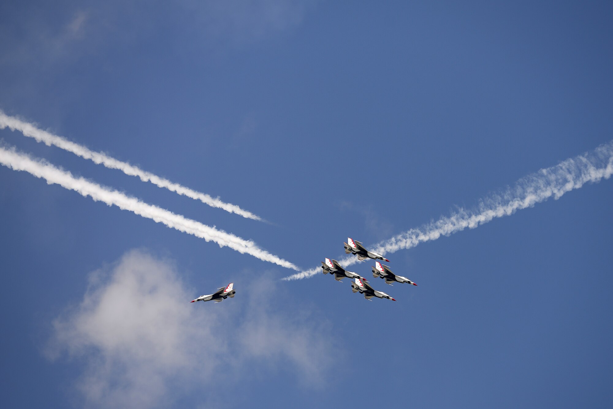 The Thunderbirds, officially known as the U.S. Air Force Air Demonstration Squadron, perform precision aerial maneuvers to demonstrate the capabilities the F-16 Fighter Falcon, the Air Force’s premier multi-role fighter jet, Scott Air Force Base, Ill., June 11, 2017.   Eight highly experienced fighter pilots, four support officers, three civilians, and over 120 enlisted personnel help make it possible for the team to showcase the capabilities of this fighter jet to millions of people each year.  Together, this team has ensured that a demonstration has never been cancelled due to maintenance difficulty. (U.S. Air Force photo by Tech. Sgt. Jonathan Fowler)