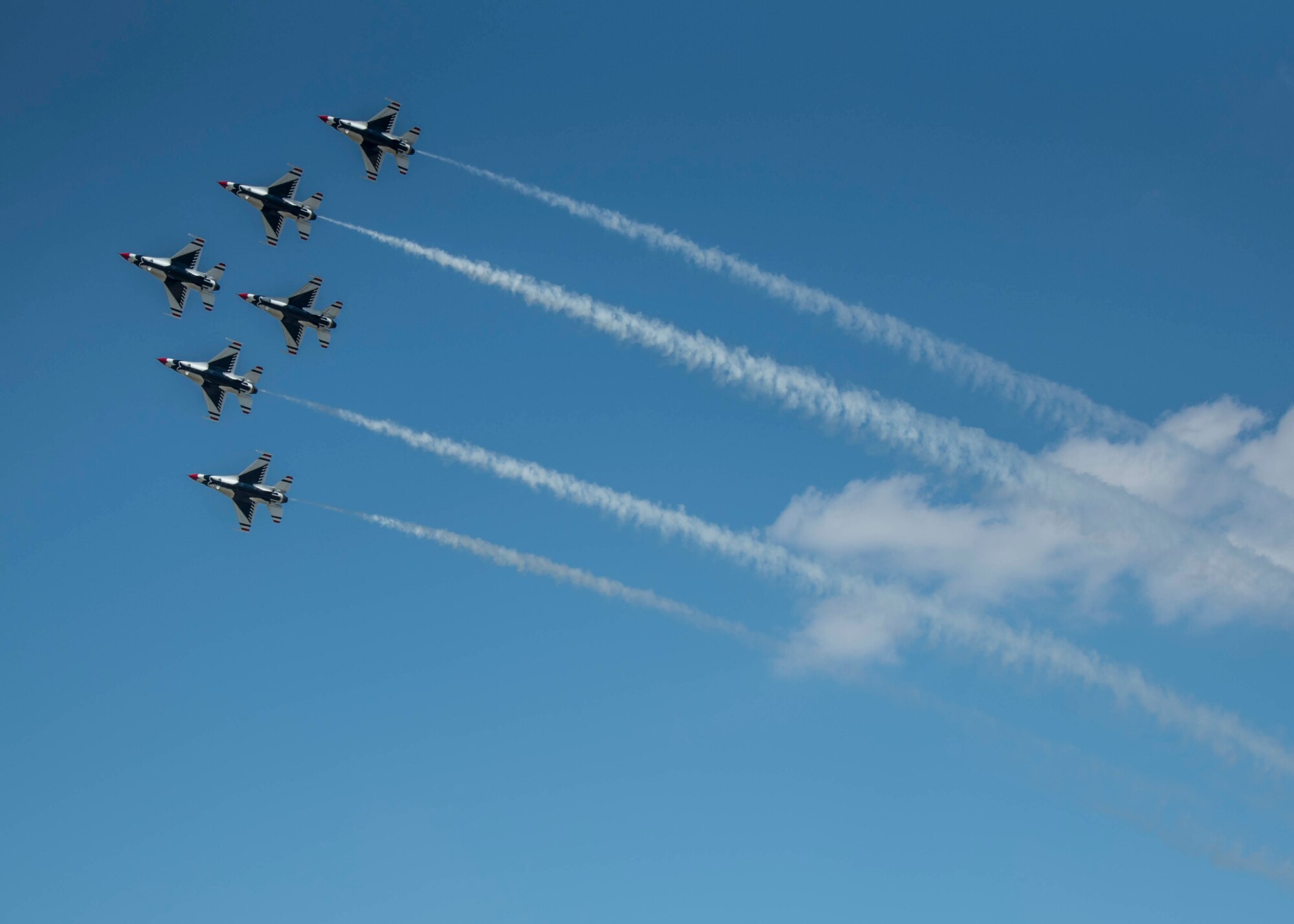 The Thunderbirds, officially known as the U.S. Air Force Air Demonstration Squadron, performs precision aerial maneuvers to demonstrate the capabilities the F-16 Fighter Falcon, the Air Force’s premier multi-role fighter jet, Scott Air Force Base, Ill., June 11, 2017.   Eight highly experienced fighter pilots, four support officers, three civilians, and over 120 enlisted personnel help make it possible for the team to showcase the capabilities of this fighter jet to millions of people each year.  Together, this team has ensured that a demonstration has never been cancelled due to maintenance difficulty. (U.S. Air Force photo by Staff Sgt. Jodi Marttinez)