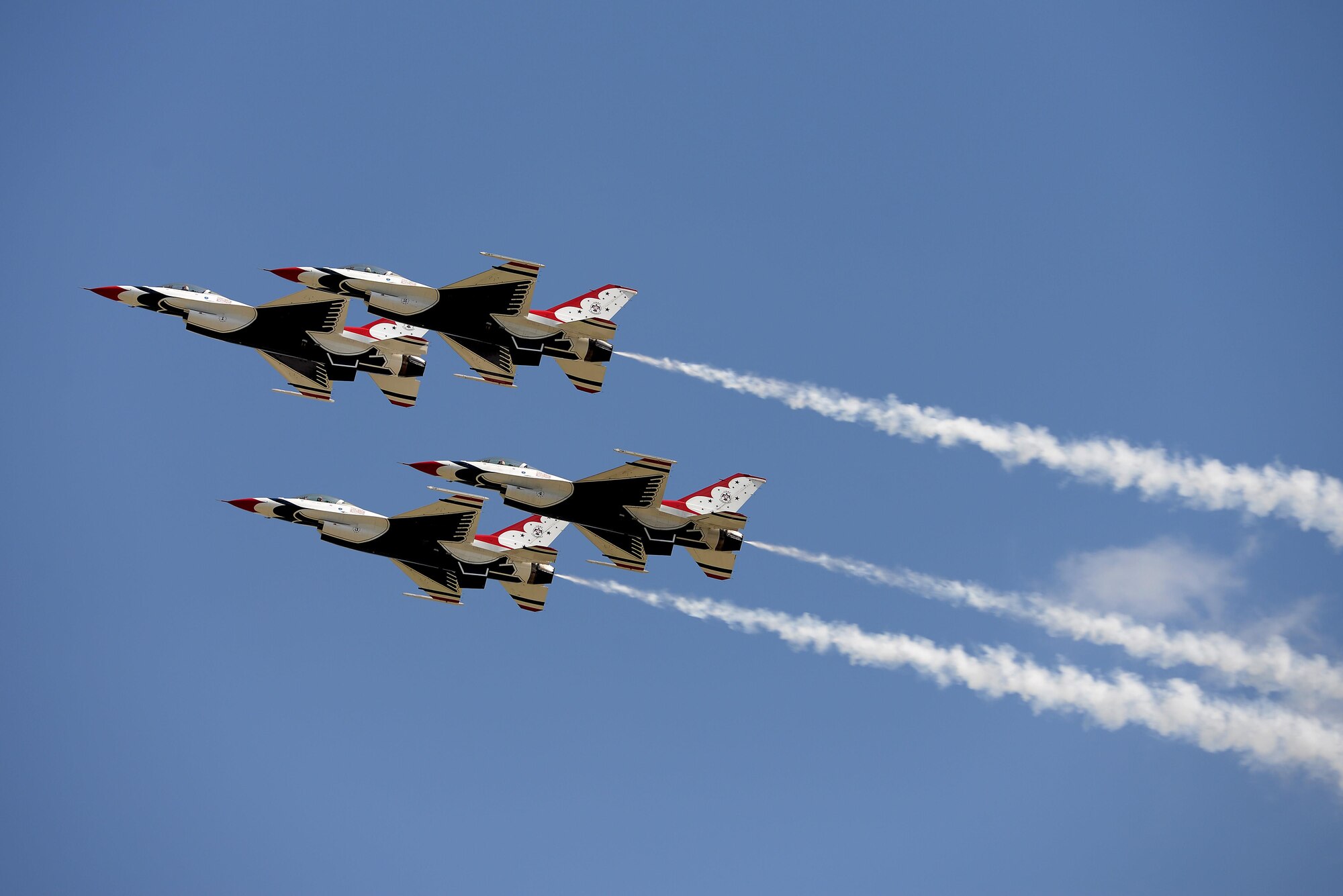 The Thunderbirds, officially known as the U.S. Air Force Air Demonstration Squadron, perform precision aerial maneuvers to demonstrate the capabilities the F-16 Fighter Falcon, the Air Force’s premier multi-role fighter jet, Scott Air Force Base, Ill., June 11, 2017.   Eight highly experienced fighter pilots, four support officers, three civilians, and over 120 enlisted personnel help make it possible for the team to showcase the capabilities of this fighter jet to millions of people each year.  Together, this team has ensured that a demonstration has never been cancelled due to maintenance difficulty. (U.S. Air Force photo by Tech. Sgt. Jonathan Fowler)