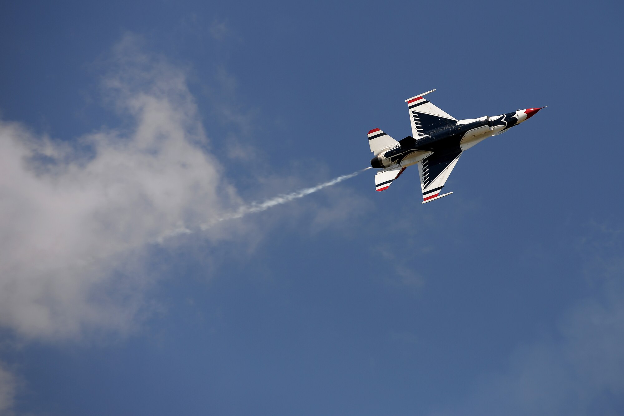 The Thunderbirds, officially known as the U.S. Air Force Air Demonstration Squadron, perform precision aerial maneuvers to demonstrate the capabilities the F-16 Fighter Falcon, the Air Force’s premier multi-role fighter jet, Scott Air Force Base, Ill., June 11, 2017.   Eight highly experienced fighter pilots, four support officers, three civilians, and over 120 enlisted personnel help make it possible for the team to showcase the capabilities of this fighter jet to millions of people each year.  Together, this team has ensured that a demonstration has never been cancelled due to maintenance difficulty. (U.S. Air Force photo by Tech. Sgt. Jonathan Fowler)