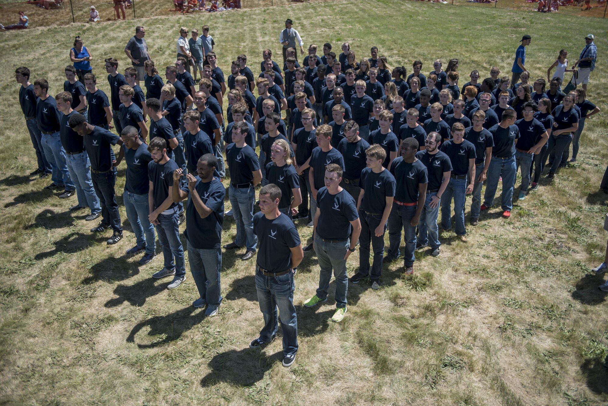 Members in the Delayed Entery Program take the official step to becoming Airmen during the Scott Air Force Base air show, June 10, 2017.  The Thunderbirds gave the oath of enlistment to over 150 enlistees, whom became a part of the Air Force family after swearing in.