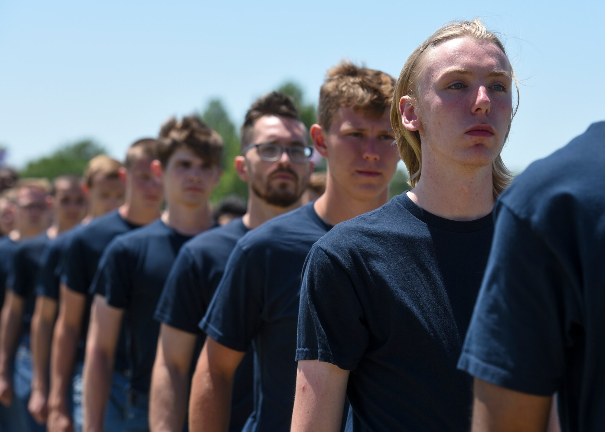 Members in the Delayed Entery Program take the official step to becoming Airmen during the Scott Air Force Base air show, June 10, 2017.  The Thunderbirds gave the oath of enlistment to over 150 enlistees, whom became a part of the Air Force family after swearing in.