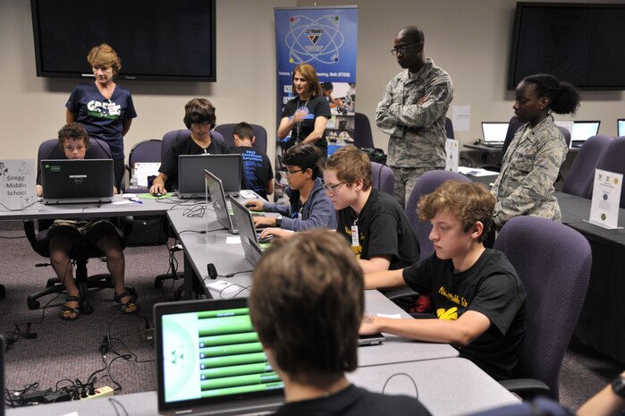 Sixth and seventh grade students compete in a multiplayer long-distance telecommunications game as part of the Space and Naval Warfare Systems Command Department of Defense Virtual DimensionU Math Competition at Joint Base Charleston, S.C., May 23rd. The adoption of the DimensionU Math program into the tri-county school district curriculum has demonstrated positive results for math testing scores.