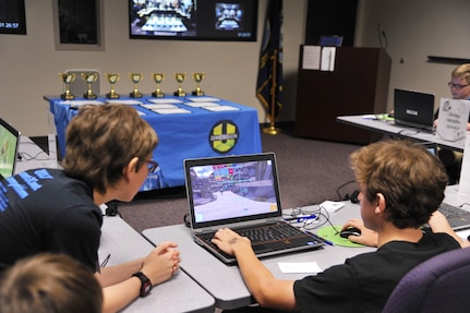 Sixth and seventh grade students compete in a multiplayer long-distance telecommunications game as part of the Space and Naval Warfare Systems Command Department of Defense Virtual DimensionU Math Competition at Joint Base Charleston, S.C., May 23rd. The adoption of the DimensionU Math program into the tri-county school district curriculum has demonstrated positive results for math testing scores.