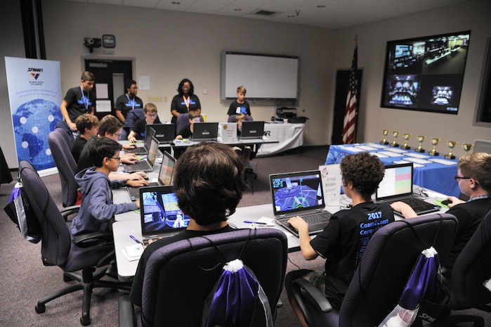 Sixth and seventh grade students compete in a multiplayer long-distance telecommunications game as part of the Space and Naval Warfare Systems Command Department of Defense Virtual DimensionU Math Competition at Joint Base Charleston, S.C., May 23rd. The adoption of the DimensionU Math program into the tri-county school district curriculum has demonstrated positive results for math testing scores.