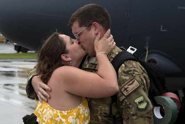 Staff Sgt. James Baker, 71st Rescue Squadron loadmaster, reunites with his fiancé, Emily Jobson, after returning from a deployment in Southwest Asia, June 7, 2017, at Moody Air Force Base, Ga. The 71st RQS provided expeditionary personnel recovery in support of Operation Inherent Resolve. (U.S. photo by Airman 1st Class Erick Requadt) 