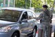 Senior Airman Aldo Enriquez, 88th Security Forces patrolman, checks an ID card of a motorist entering the base at the newly opened Gate 19B at Wright-Patterson Air Force Base, Ohio, June 12, 2017. (U.S. Air Force photo/Wesley Farnsworth)
