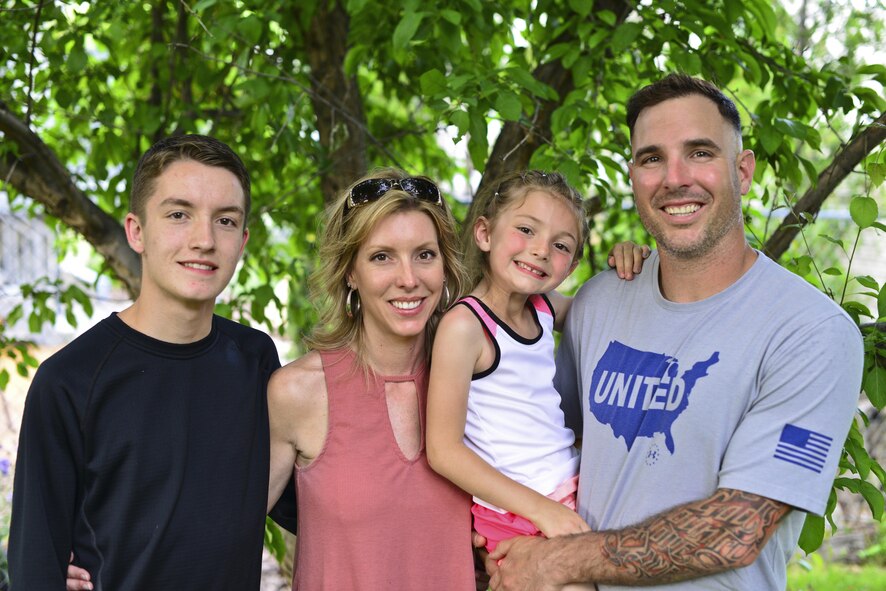 Tech. Sgt. Christopher D’Angelo, right, a missile alert facility manager with the 490th Missile Squadron, Malmstrom Air Force Base, Mont., poses for a photo with his wife, Chanda, son, Jace and daughter, Brittyn at their home in Great Falls, Mont., June 7, 2017. D’Angelo was diagnosed with post-traumatic stress disorder after he was injured by an improvised explosive device January 15, 2008. He said his wife has been very supportive with helping him cope with his PTSD. (U.S. Air Force photo/Master Sgt. Chad Thompson)