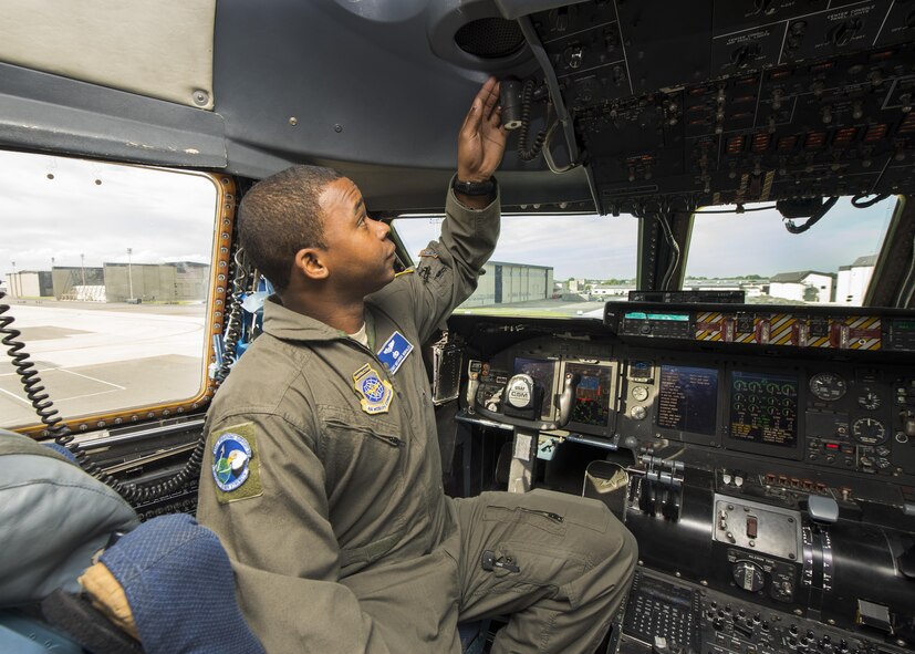 Staff. Sgt. Meco Morales, C-5M Formal Training Unit flight engineer instructor, goes through preflight procedures June 8, 2017, inside a C-5M Super Galaxy flight deck on Dover Air Force Base, Del. The FTU has been responsible for training new C-5M Super Galaxy pilots and flight engineers. (U.S. Air Force photo by Senior Airman Zachary Cacicia)