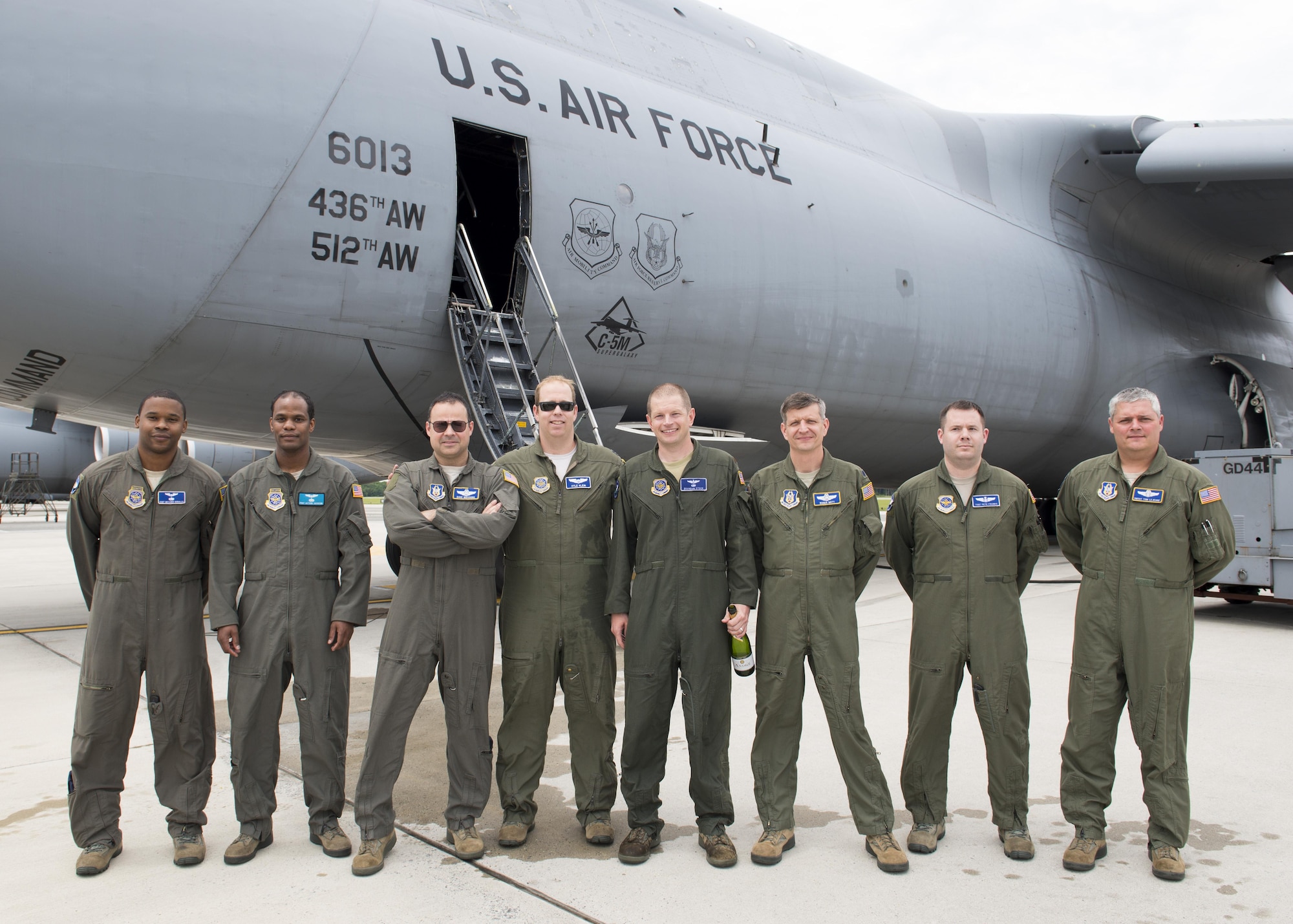 A C-5M Super Galaxy aircrew poses for a photo after the final C-5M Formal Training Unit training flight June 8, 2017, at Dover Air Force Base, Del. All C-5M FTU operations will now take place at Joint Base San Antonio-Lackland, Texas. (U.S. Air Force photo by Senior Airman Zachary Cacicia)