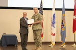 DLA Distribution’s outgoing Future Operations deputy director Navy Supply Corps Cmdr. Steve Macdonald was honored with the Defense Meritorious Service Medal for his accomplishments from May 2014 to June 2017 on June 6.