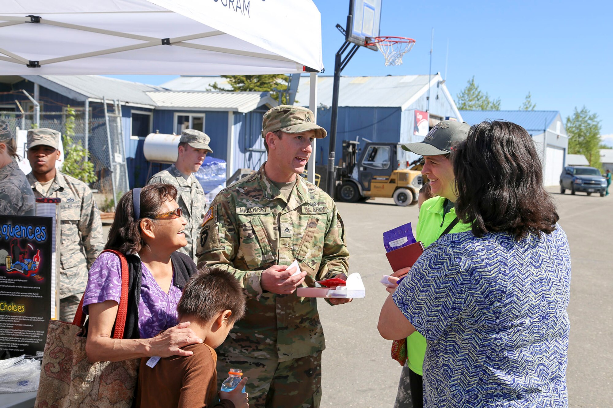 Alaska National Guard Sgt. Austin Makowski, civil operator with the Counterdrug Support Program, discusses the procedures for using the Narcan kit with local residents at the Edward G. Pitka Sr. Airport in Galena, Alaska, May 31, 2017. Twelve Guardsmen from the CDSP traveled to the Yukon-Koyukuk Region hub to deliver the kits that block the effects of opioids and reverses an overdose, and to provide drug and alcohol education and prevention materials to local residents. (U.S. Army National Guard photo by Staff Sgt. Balinda O’Neal Dresel)