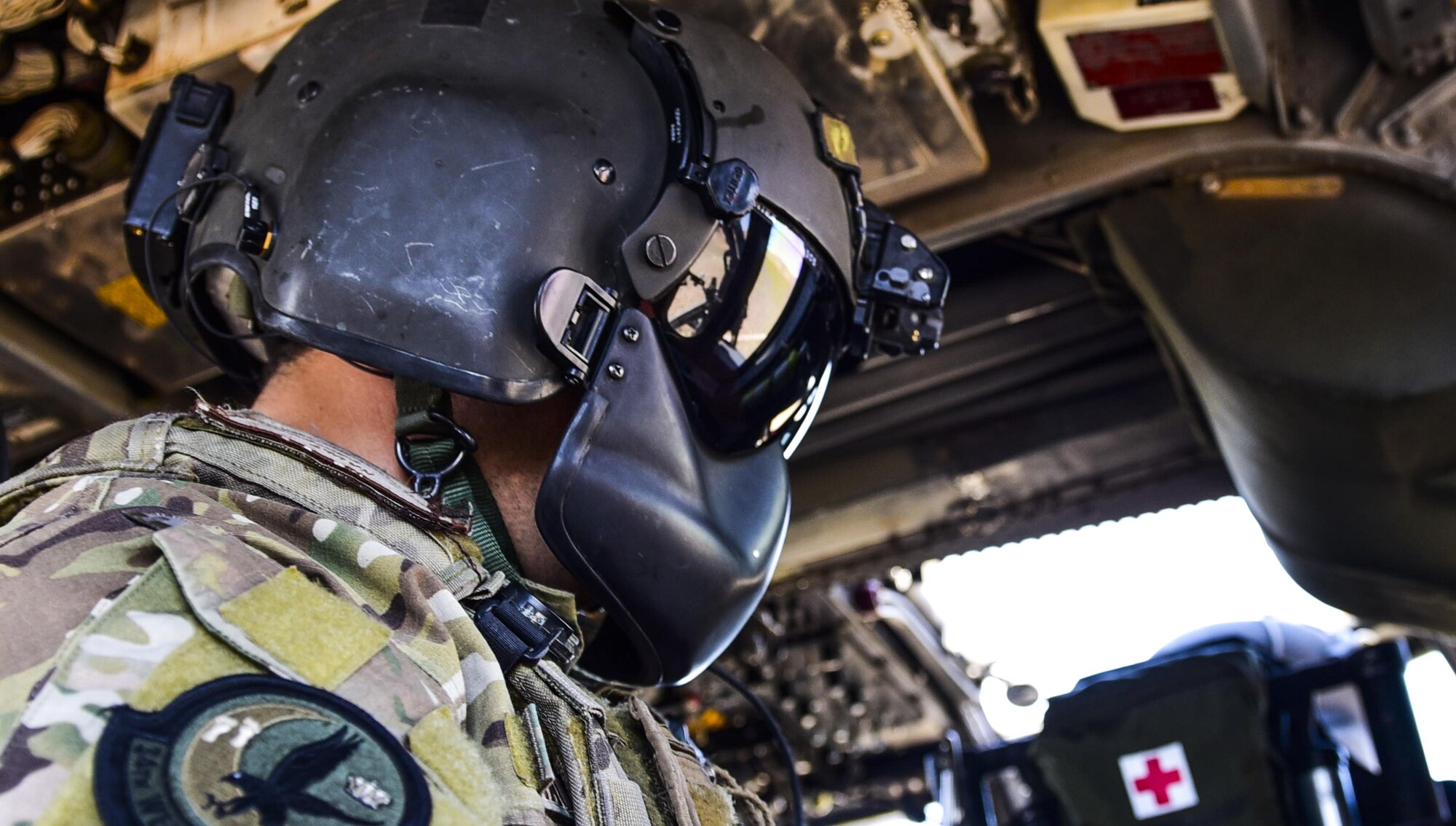 Staff Sgt. Christian Nault, 34th Weapons Squadron special mission aviator, performs a system check on an HH-60G Pave Hawk helicopter during a Weapons School Integration mission at the Nevada Test and Training Range June 1, 2017. Special mission aviators are responsible for assisting the pilots with everything from pre-flight inspections to weapon defense, if needed. (U.S. Air Force photo by Airman 1st Class Andrew D. Sarver/Released)